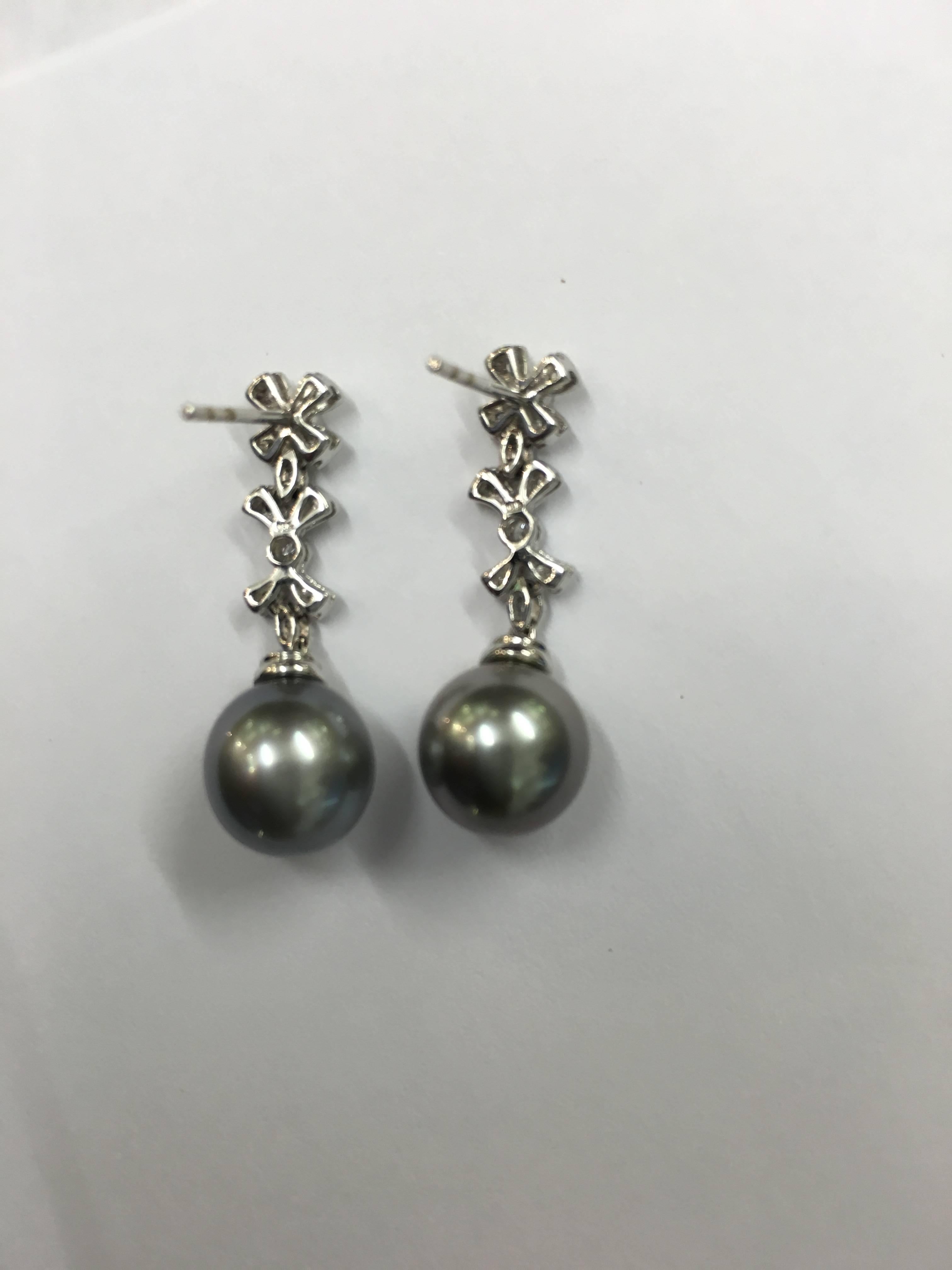 Diamond set 18ct White Gold Drops with Grey Tahitian pearls for pierced ears
with post and butterfly fittings. Set with white diamonds 