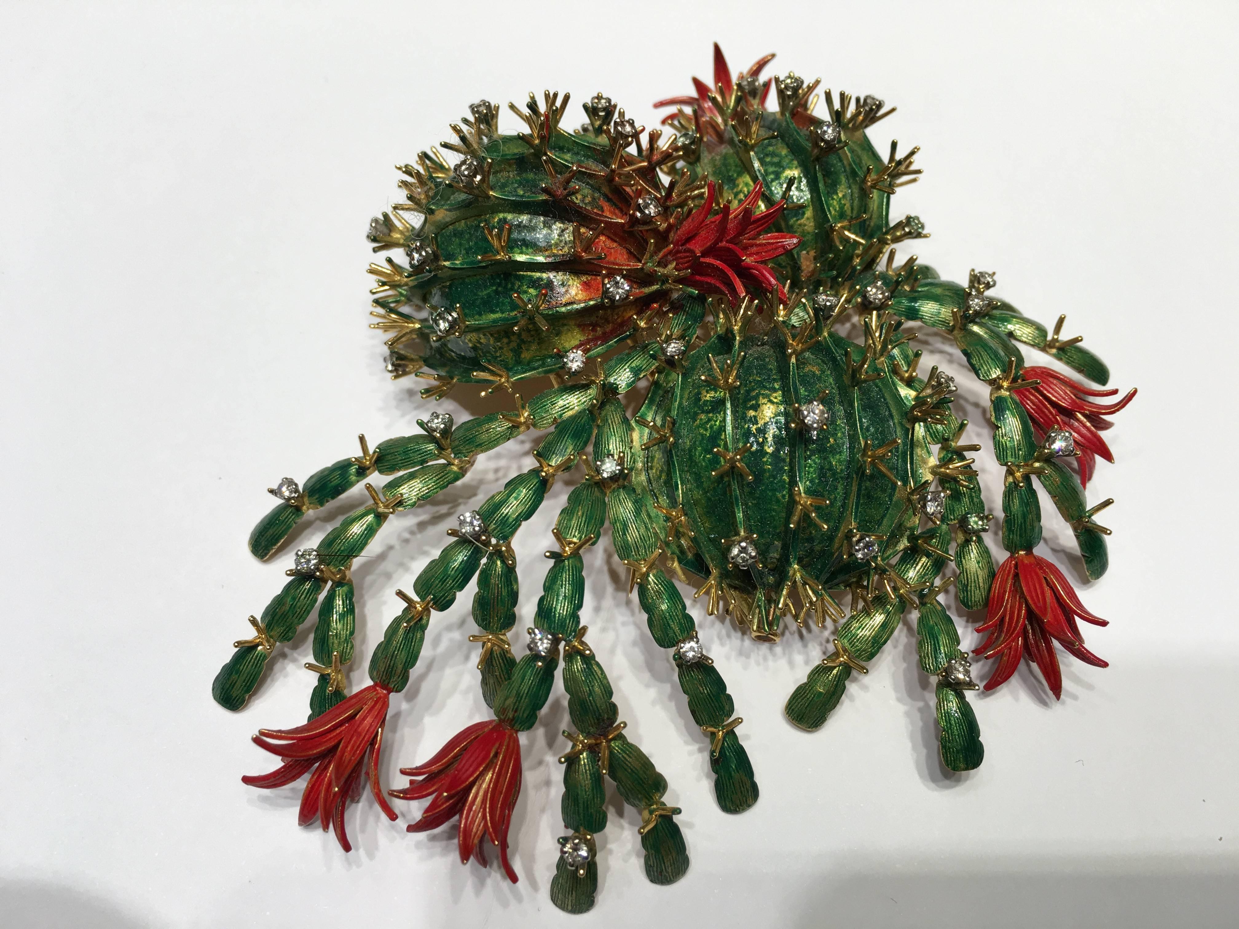 This amazing Brooch is copying nature at its best its is a very best, it is based on the Schlumberger (Christmas Cactus) which has been crafted in 18ct Gold and set with diamonds and beautifully enamelled in Green and Red Enamel it is also