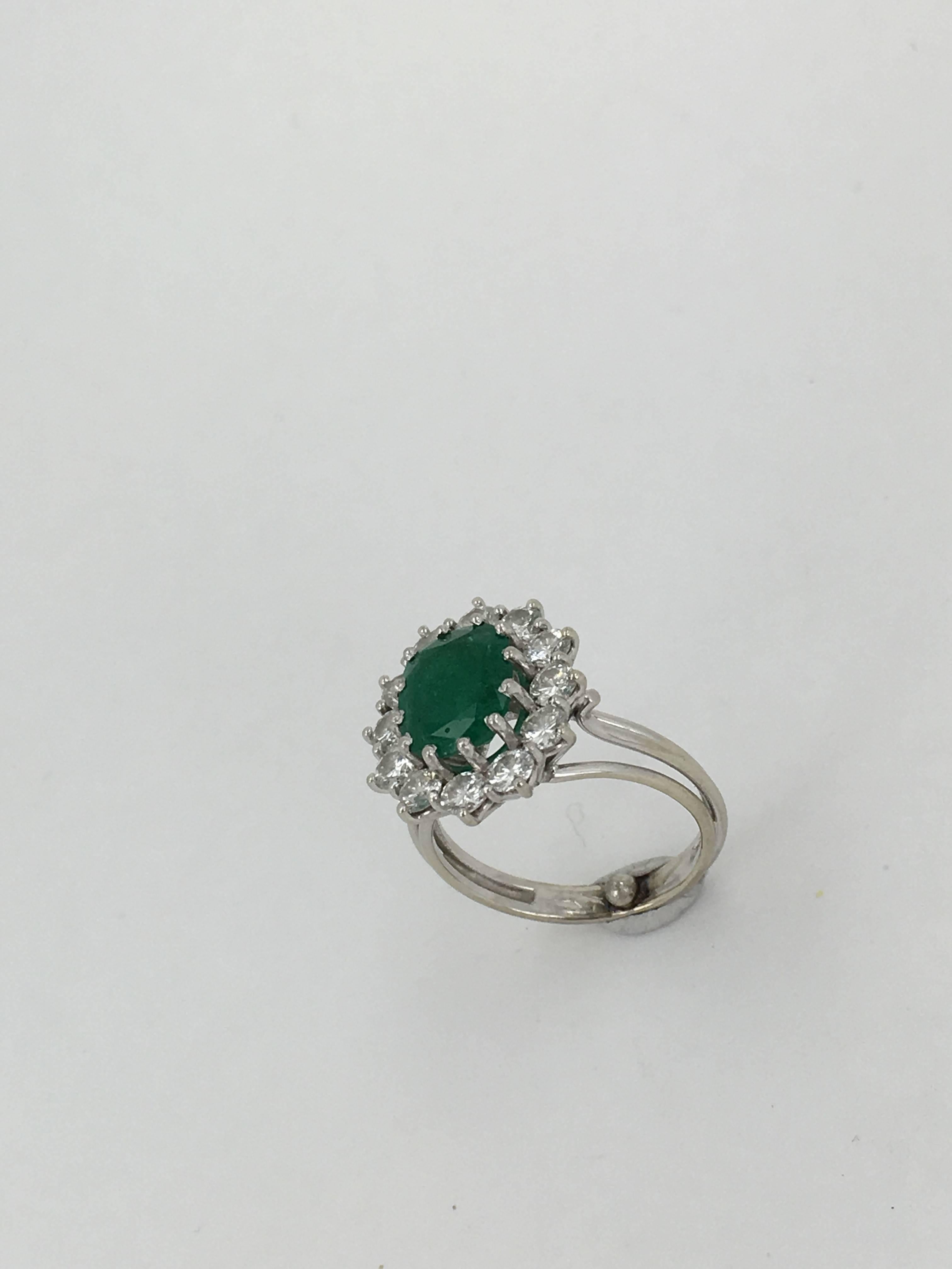 Modern 2.50 Carat Oval Cut Emerald Diamond Gold Cluster Ring For Sale