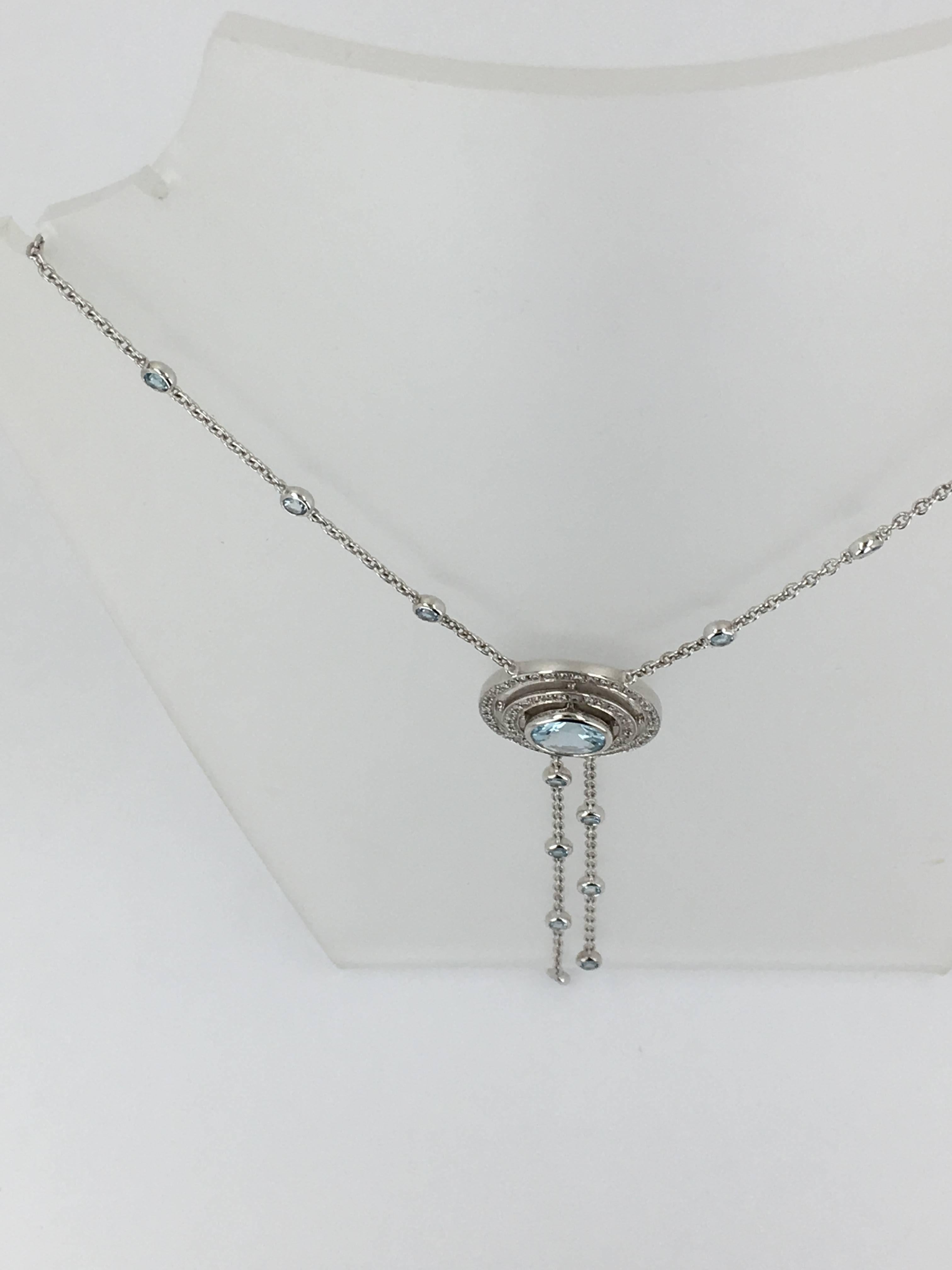 Theo Fennell Aquamarine and Diamond Necklace Fully Signed by Theo Fennell complete with original box. Set in 18ct White Gold.With Aquamarine centre surrounded by diamonds the tassels and the chain are set with Aqurmarine round stones. The necklace