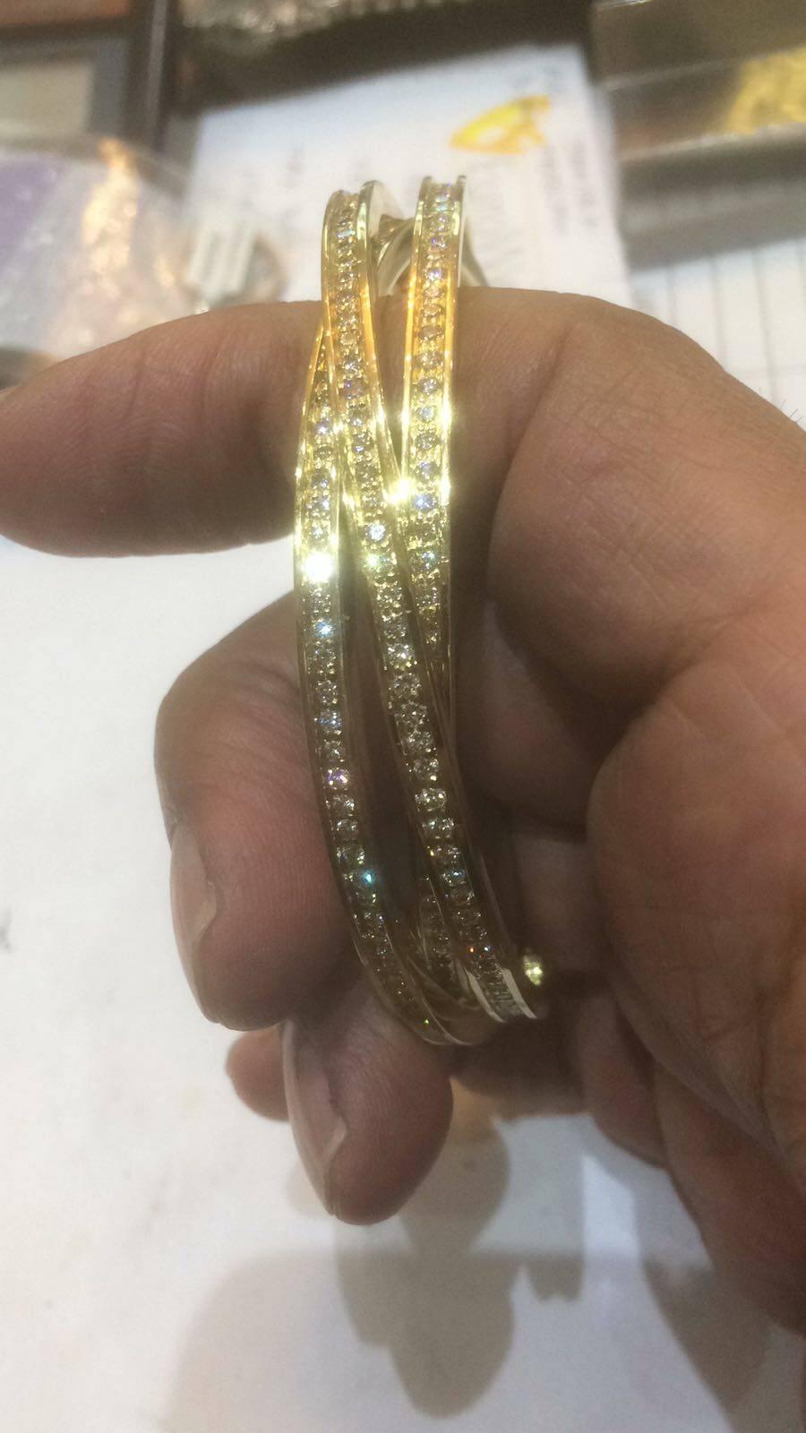 Cartier Classic Trinity Bangle made of 18ct Yellow Gold set with fine diamonds
fully signed by Cartier.Elegant addition to any Ladies jewellery collection.