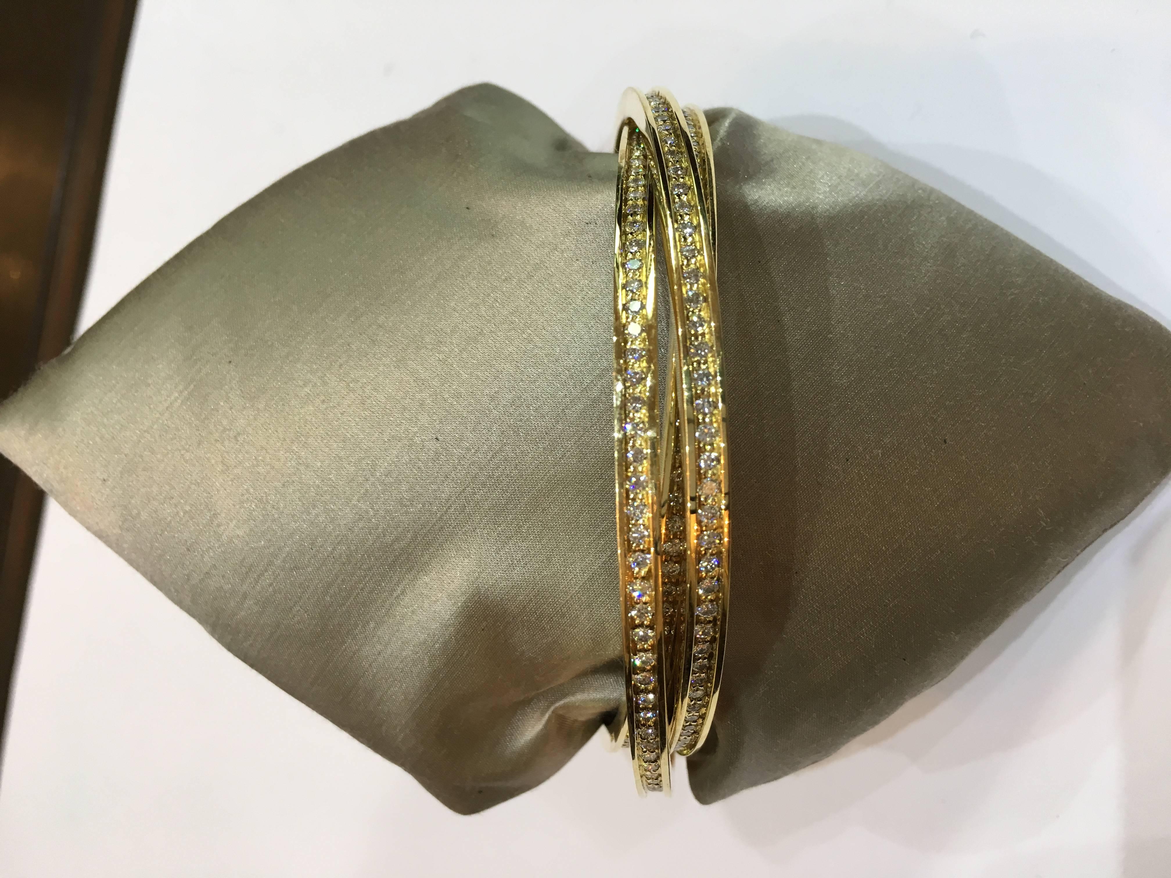 Cartier Diamond Gold Trinity Bangle Bracelet In Excellent Condition For Sale In London, GB