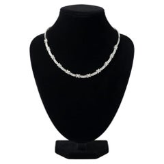 Dual Illumination - Round & Baguette Diamonds set in a designer necklace in 18K