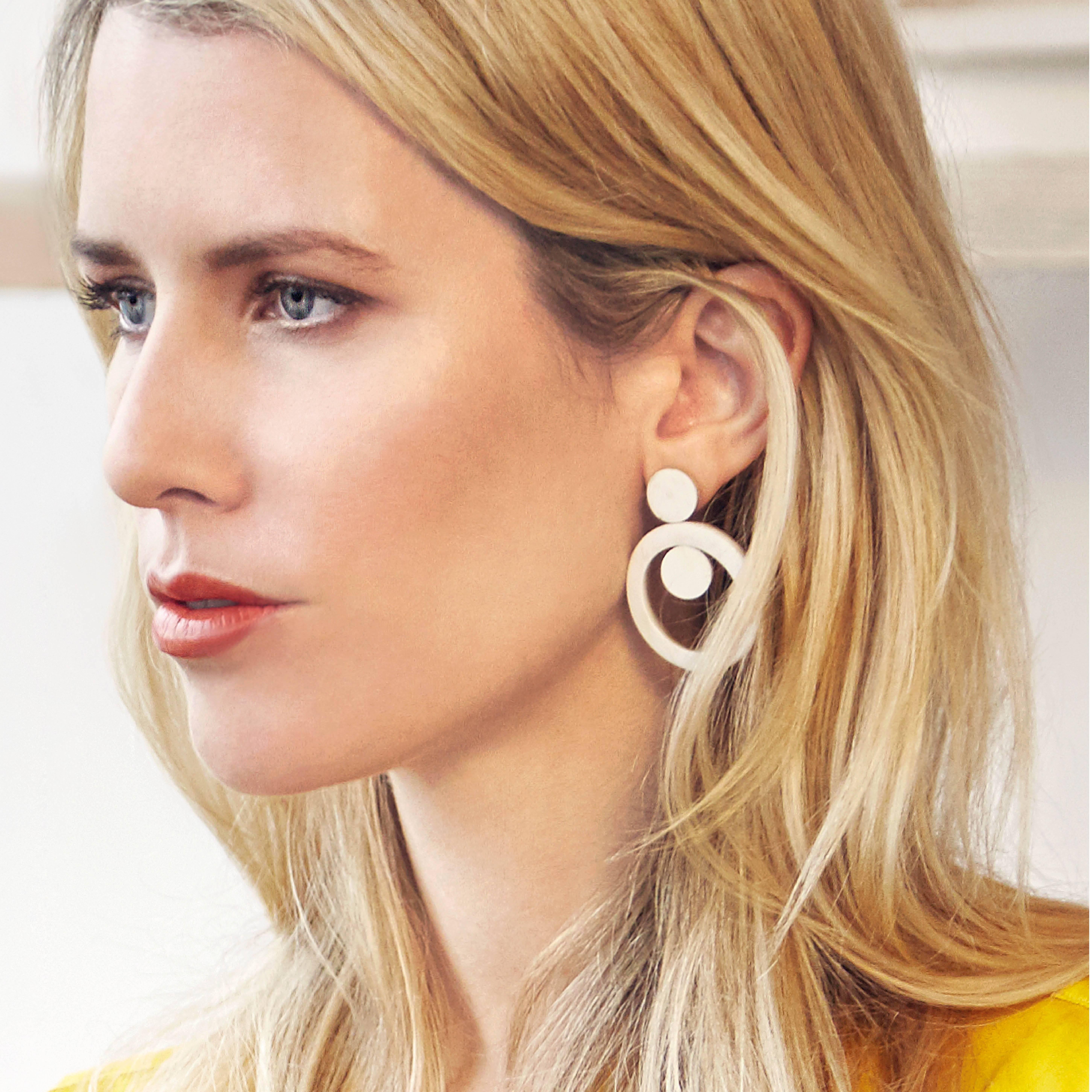 These unique earrings are carved by hand from African cow horn by artisans in Kenya, East Africa. 

Handmade from natural materials with silver pin-backs. Please note that horn graining and slight irregularities may occur. 

The Fouché collection