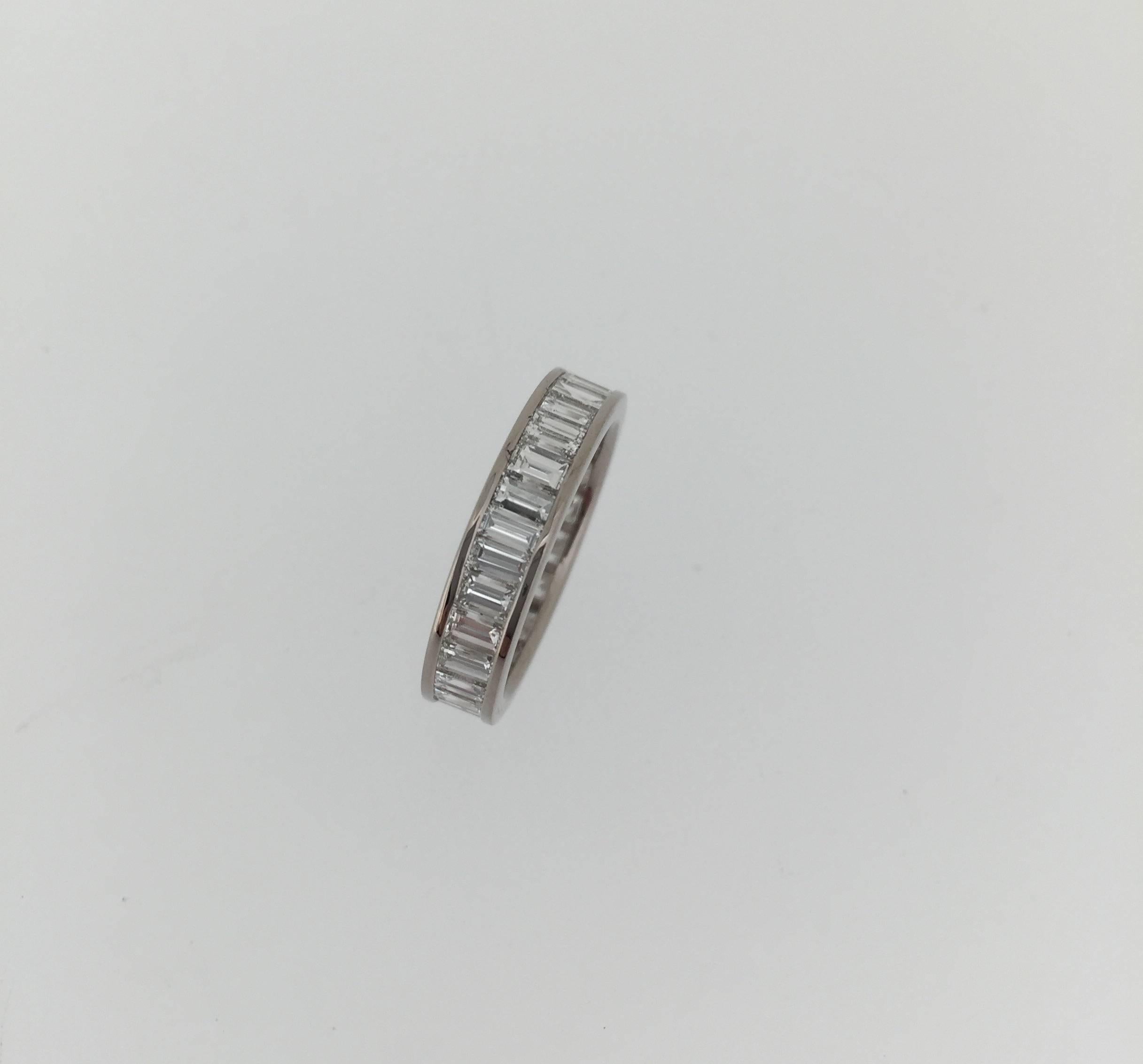 This custom made full diamond eternity ring is invisibly-set with the finest quality baguette cut diamonds of G VS quality; set in 18k white gold channel setting all the way around. Approx. diamond weight is 3.5 carat. Crafted by master craftsmen in