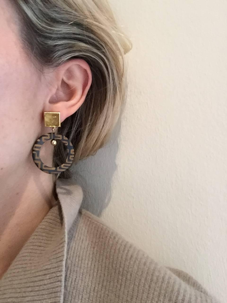 African cow horn engraved earrings set with citrine in sugar-loaf shape. Crafted by artisans in Kenya and finished by hand in London with brass and solid silver pin-backs for pierced ears. 

The Fouché collection is designed by Claire Fouché, former