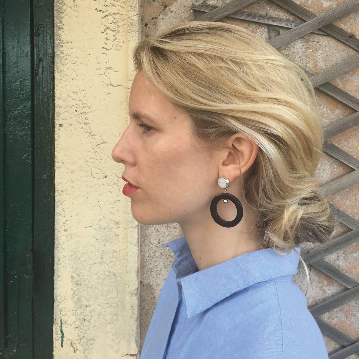 These finely crafted African moonstone and cow horn earrings are carved by artisans in Kenya, East Africa and finished to the finest quality in London. 

Handmade from natural materials with silver pin-backs for pierced ears. Please note that slight