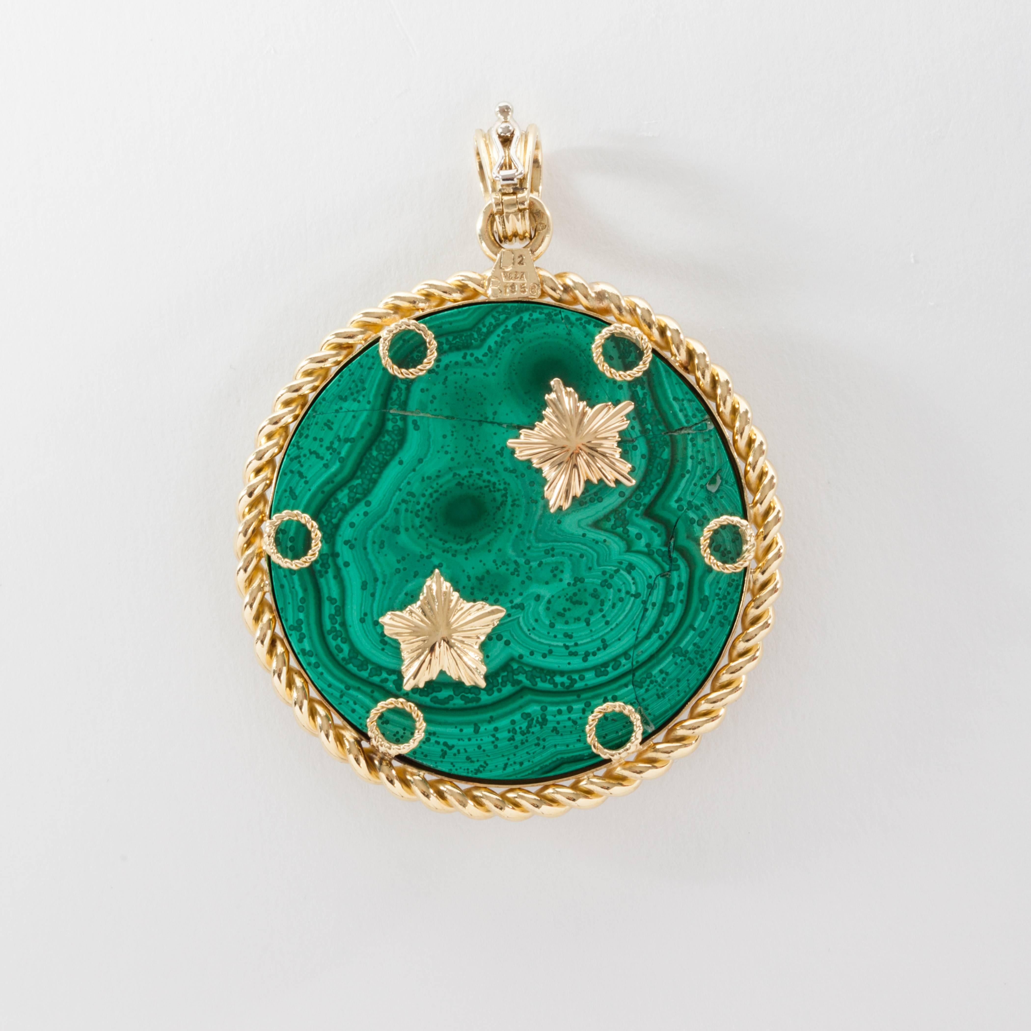 Van Cleef & Arpels 18K gold zodiac medallion. Aries sign on malachite, with one diamond on the star and one emerald eye. Two gold stars are fixed to the reverse side of the pendant. 

Signed VCA.
Circa 1970s