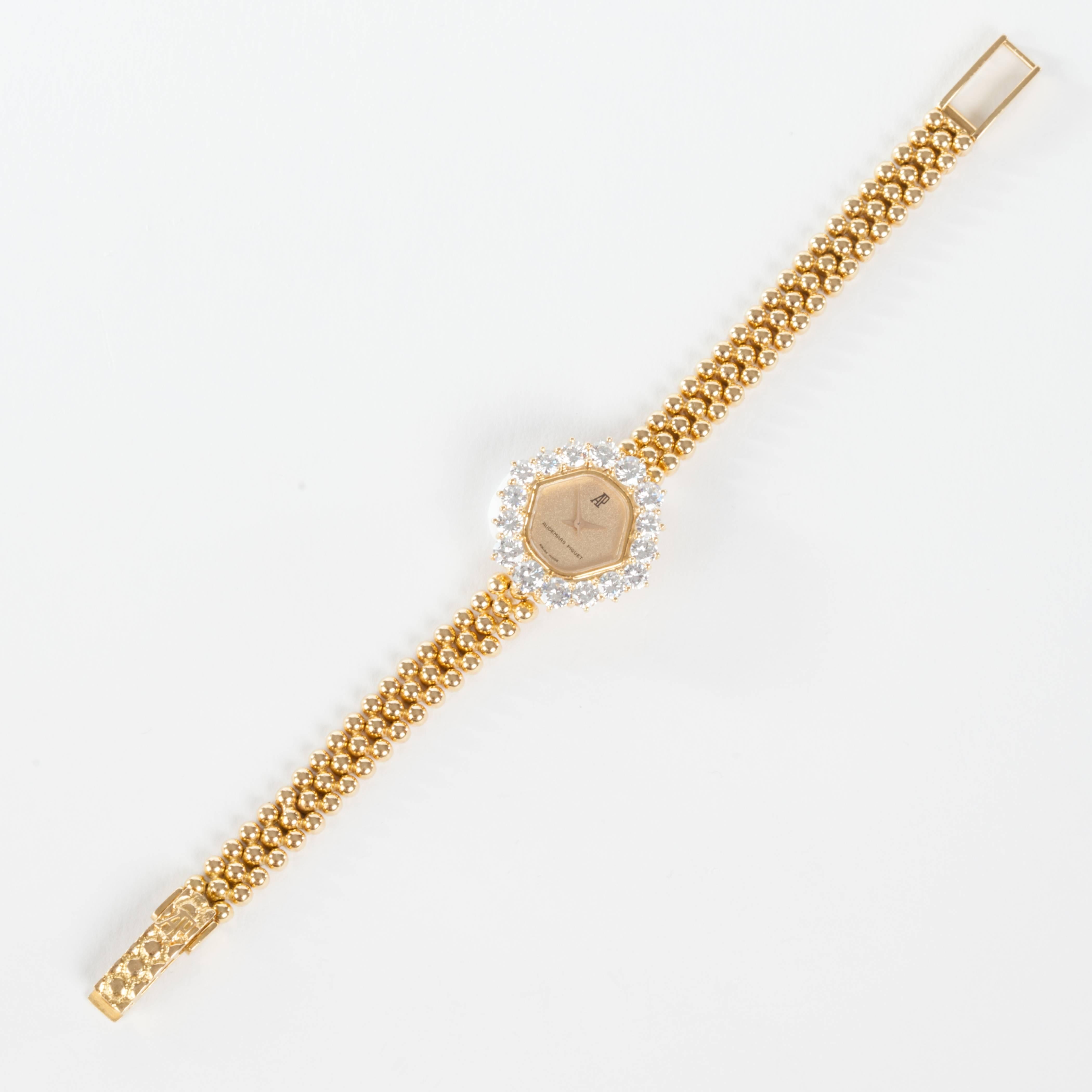 very nice yellow gold  diamond Audemars Piguet wristwatch.
16 diamonds 0,30centieme each around it
serial number /01316
circa 1970