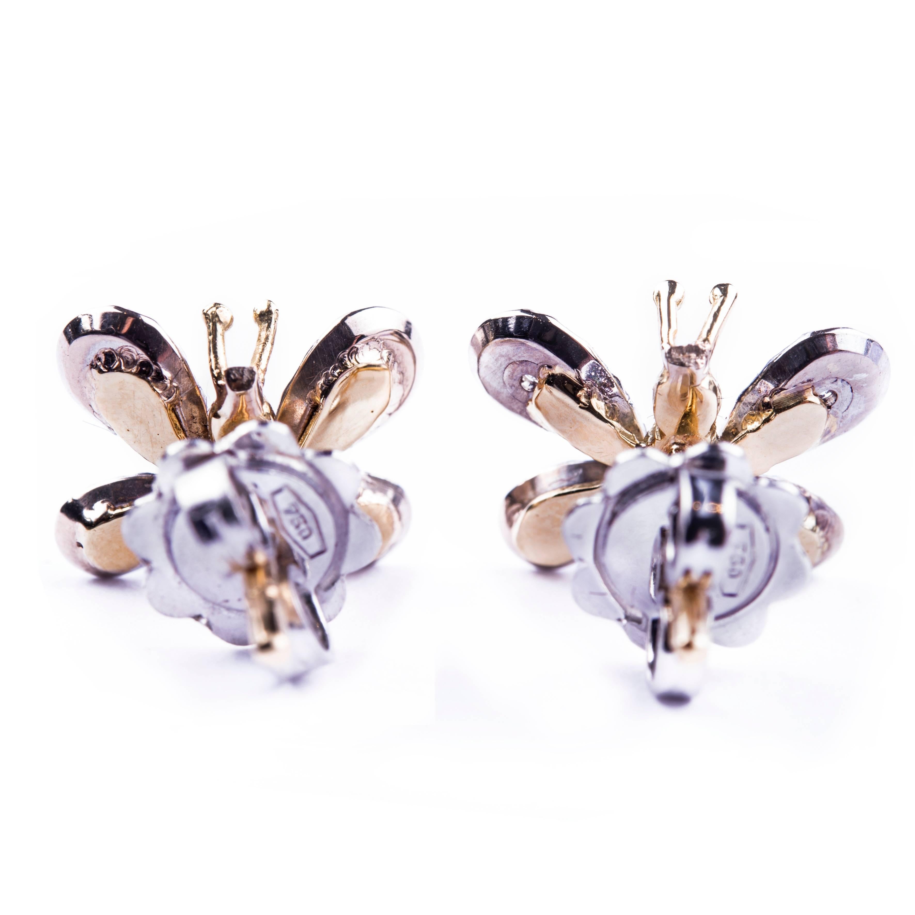 A delicate pair of diamond butterfly stud earrings 