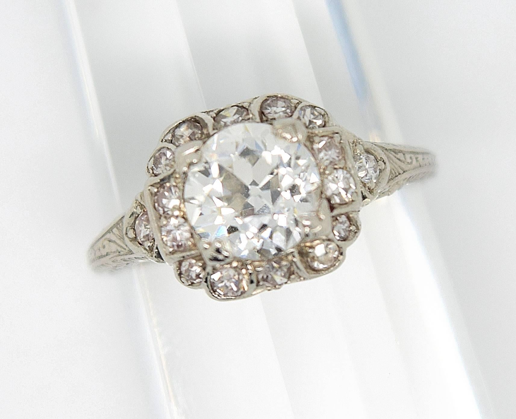 Stunning Art Deco Old European cut diamond and platinum engagement ring. The center old European cut diamond is approximately 1.25ct G/H color and VS1 clarity. The ring is enhanced by 16 side old cut diamonds. The handmade ring is designed in a