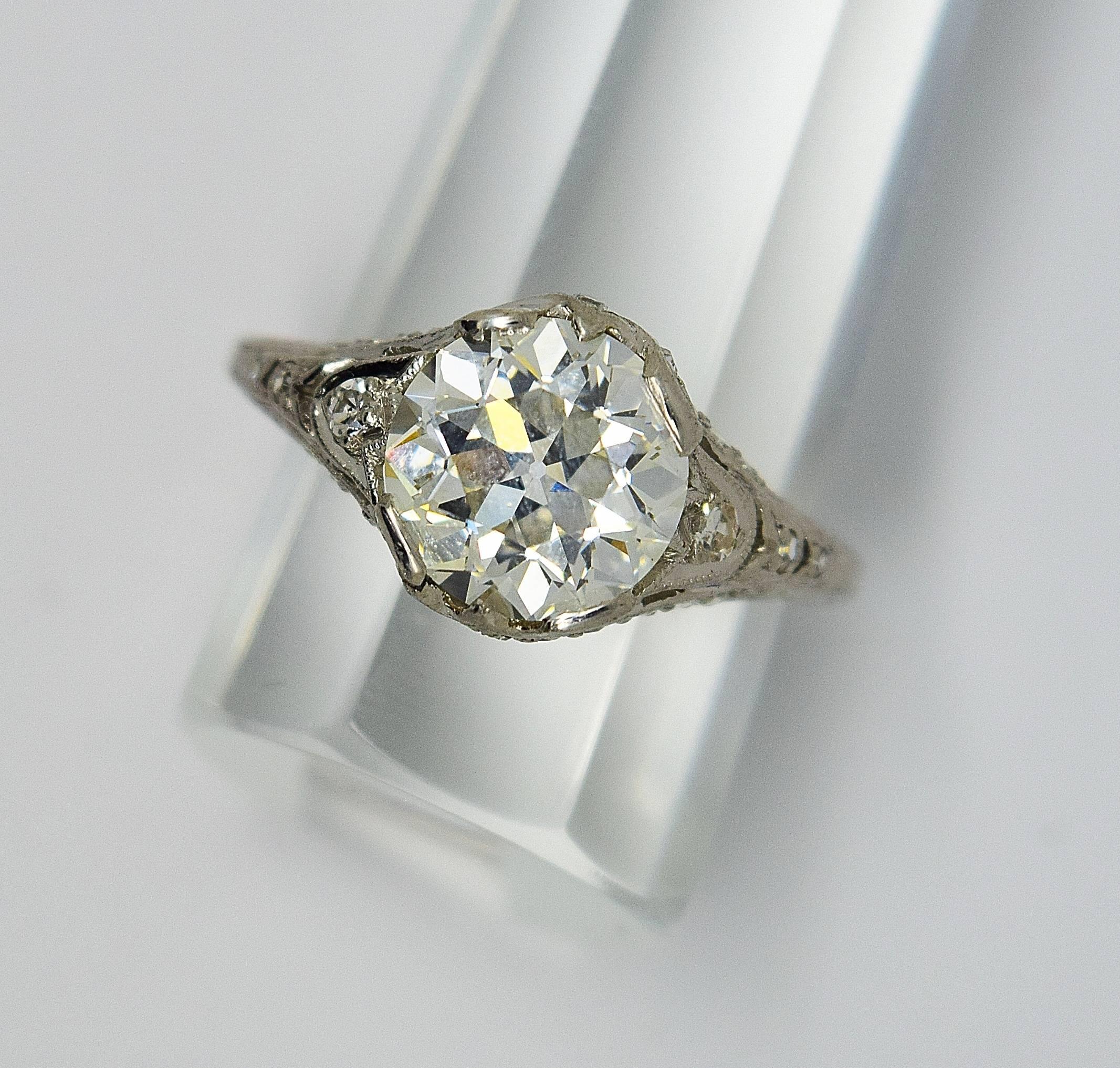 Large exceptional Art Deco old European cut diamond engagement ring set in platinum. The fine old European cut diamond is K in color and VS1 in clarity and has a GIA report #5172613450. The handmade ring has beautiful filigree and miligrain design