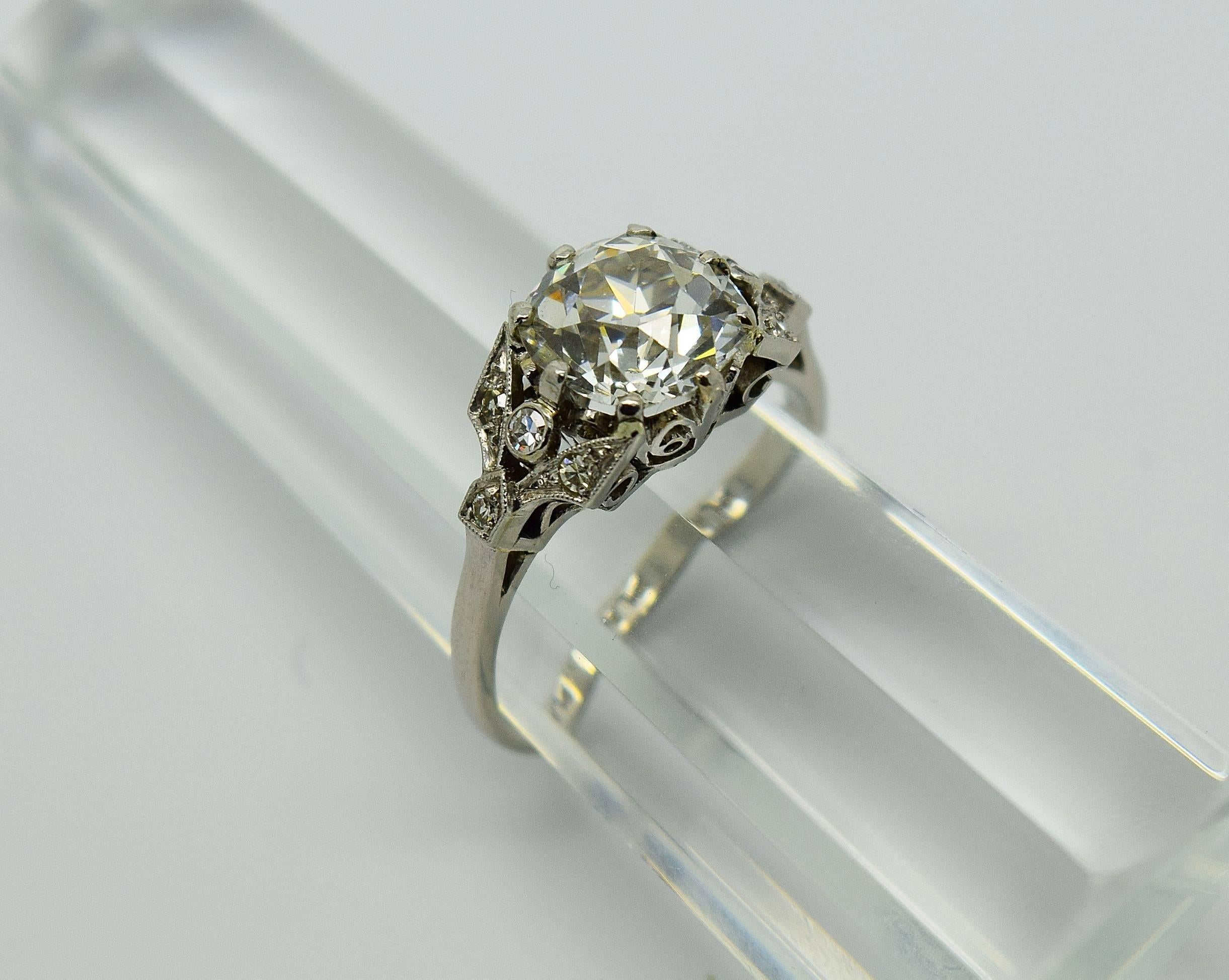 Gorgeous antique old mine brilliant cut diamond ring set in platinum. Believed to be Edwardian the ring is centered by an approximate 2.25 carat Old Mine cut diamond that is approximately H-I in color and VS1 in clarity. The ring also features 8