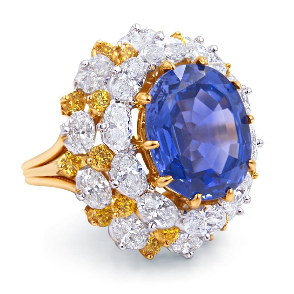 Important Oscar Heyman Sapphire and Diamond ring set in 18k gold and platinum. The ring is centered by a 12.16ct (estimated) ceylon untreated unheated blue sapphire with an AGL report #CS 45264. The ring is also set with over 5 carats of gem quality