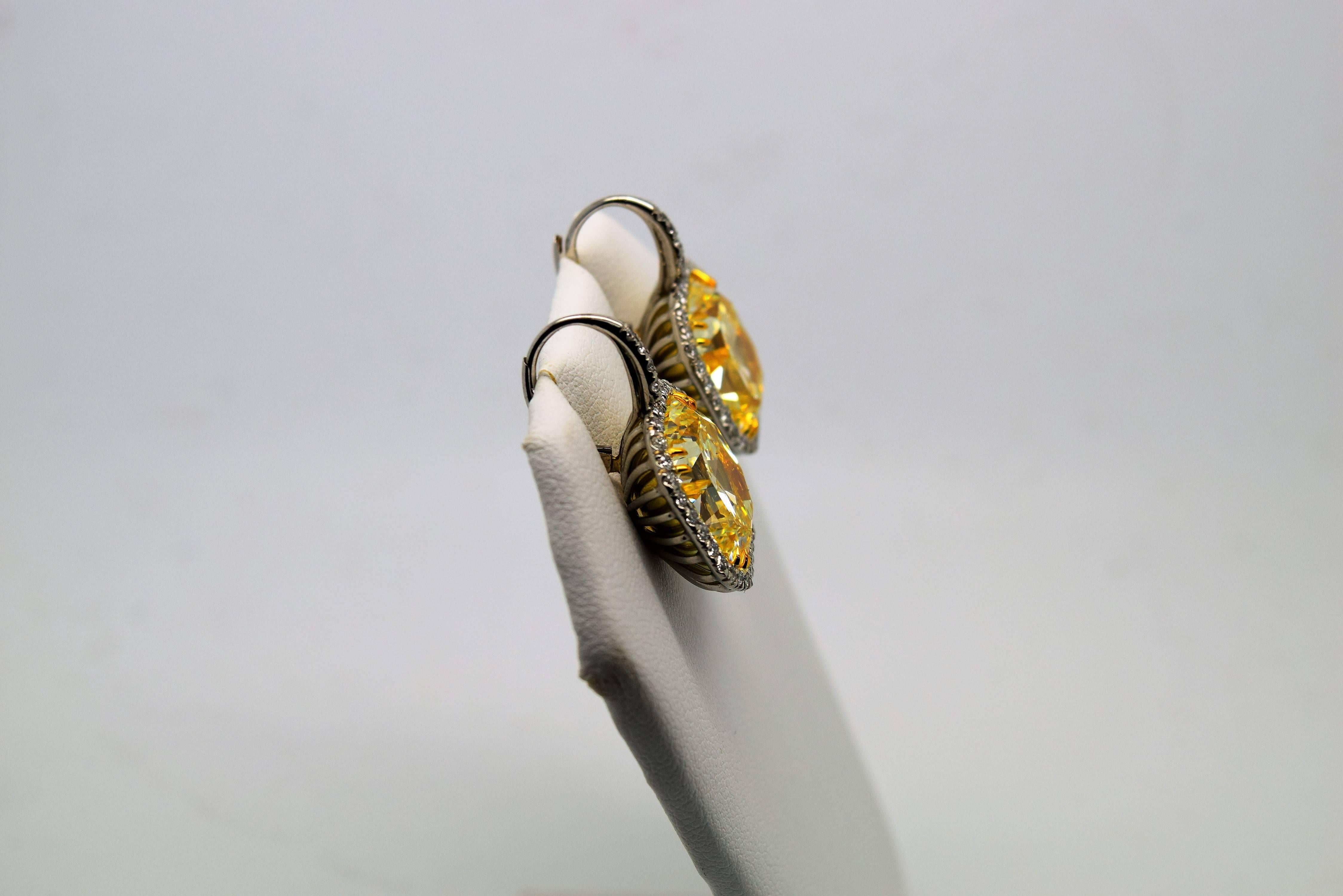 Important 24.33 Carats GIA Cert Fancy Yellow Radiant Cut Diamonds Earrings In New Condition In Chicago, IL