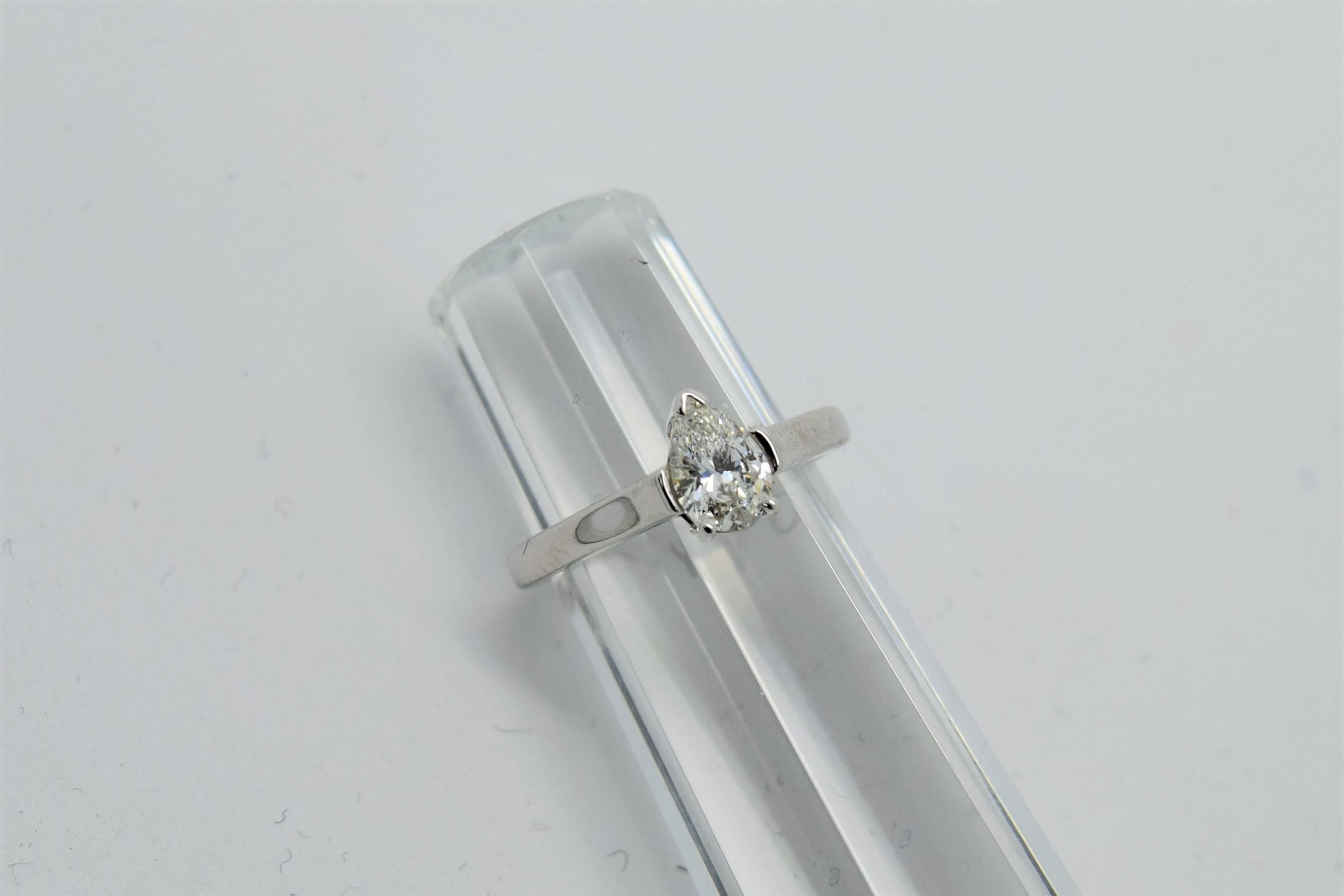Unique Tiffany and Co. pear shape diamond engagement ring in platinum.
The pear shape diamond weighs 0.55ct and is approximately F in color and VS1 in clarity.
Ring size 4 1/4 (re-sizable)
Hallmarks 