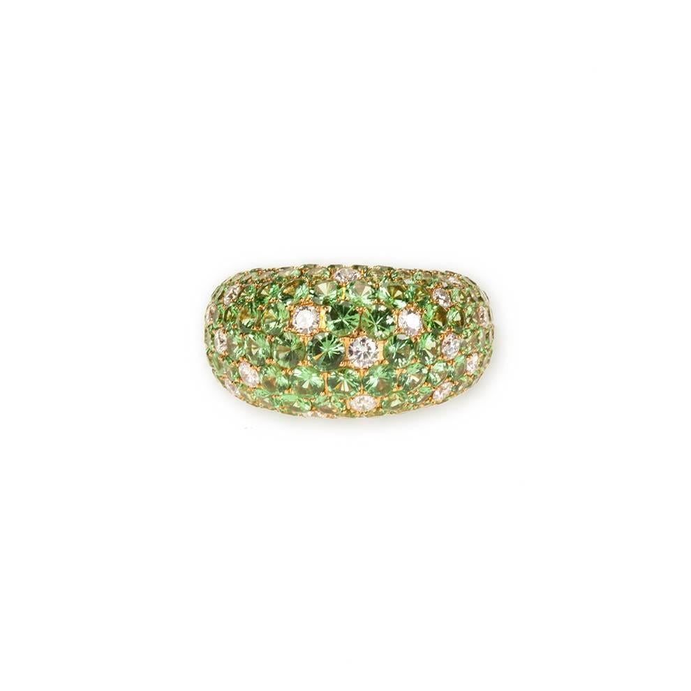 18 Karat Yellow Gold Ring Featuring 183 Pavé Set Round Brilliant Tsavorite Garnet, 8.20 Carats, and 24 Round Brilliant Diamonds, 0.90 Carats of F Color and VS Clarity.

Stamped: 750

Size: 6 1/2