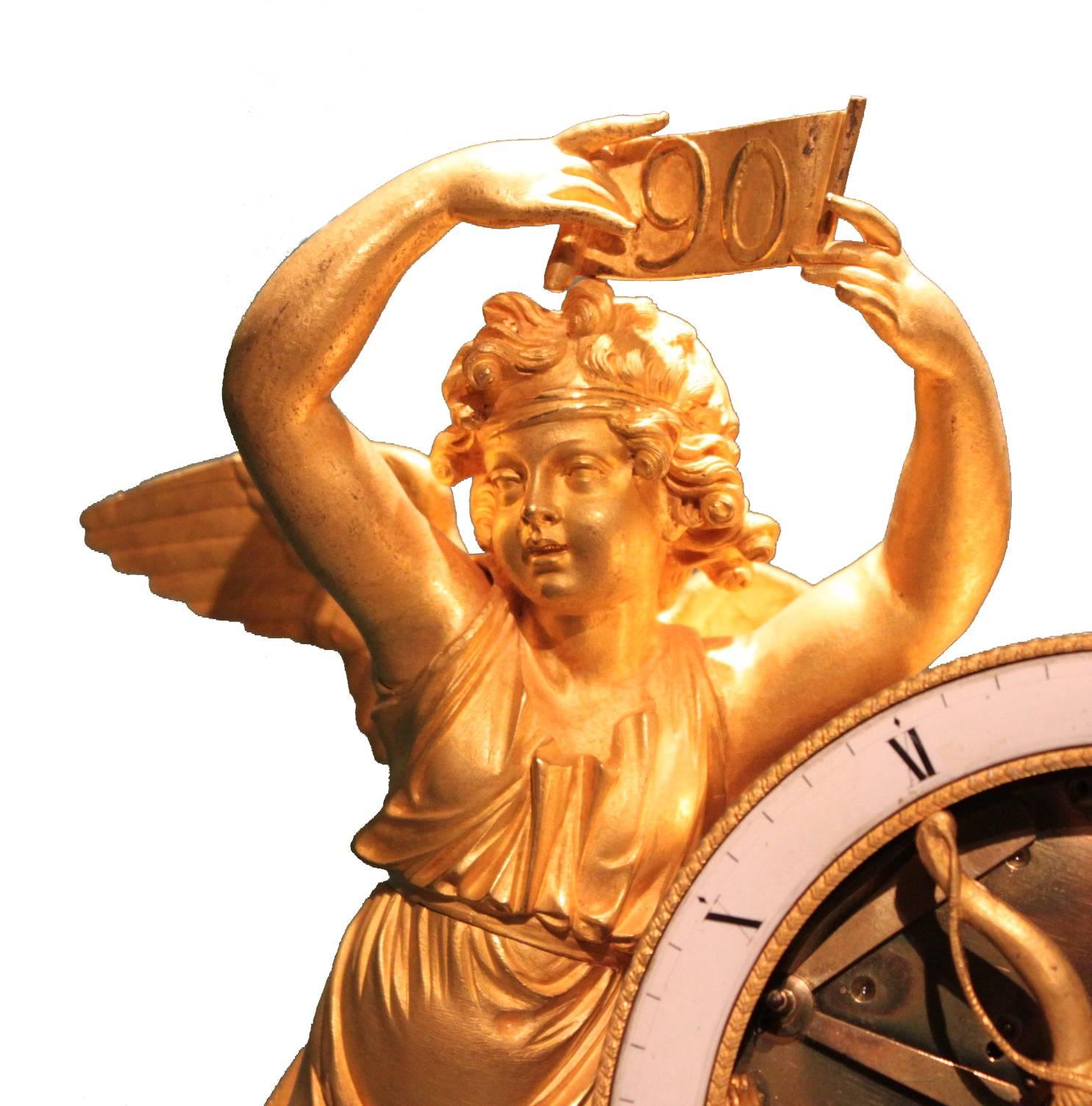 We proudly present this beautiful 1st periode empire pendule.

The putto is holding the winning ticket to the lottery and on the side you see the fortune is flowing with wealth. In the centre you see a putto reading the fortune of a lady's