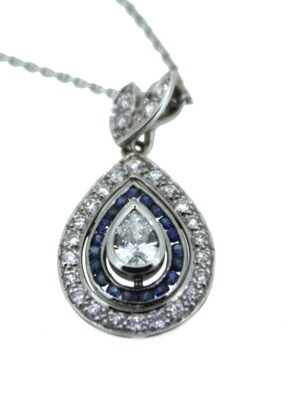 This beautiful time piece made of 14K white gold is decorated with diamond and blue sapphires.

In the center is 0.75 carat pear shape diamond, decorated around are 22 royal blue sapphires, at the edge of the pendent are 26 briljant cut diamonds