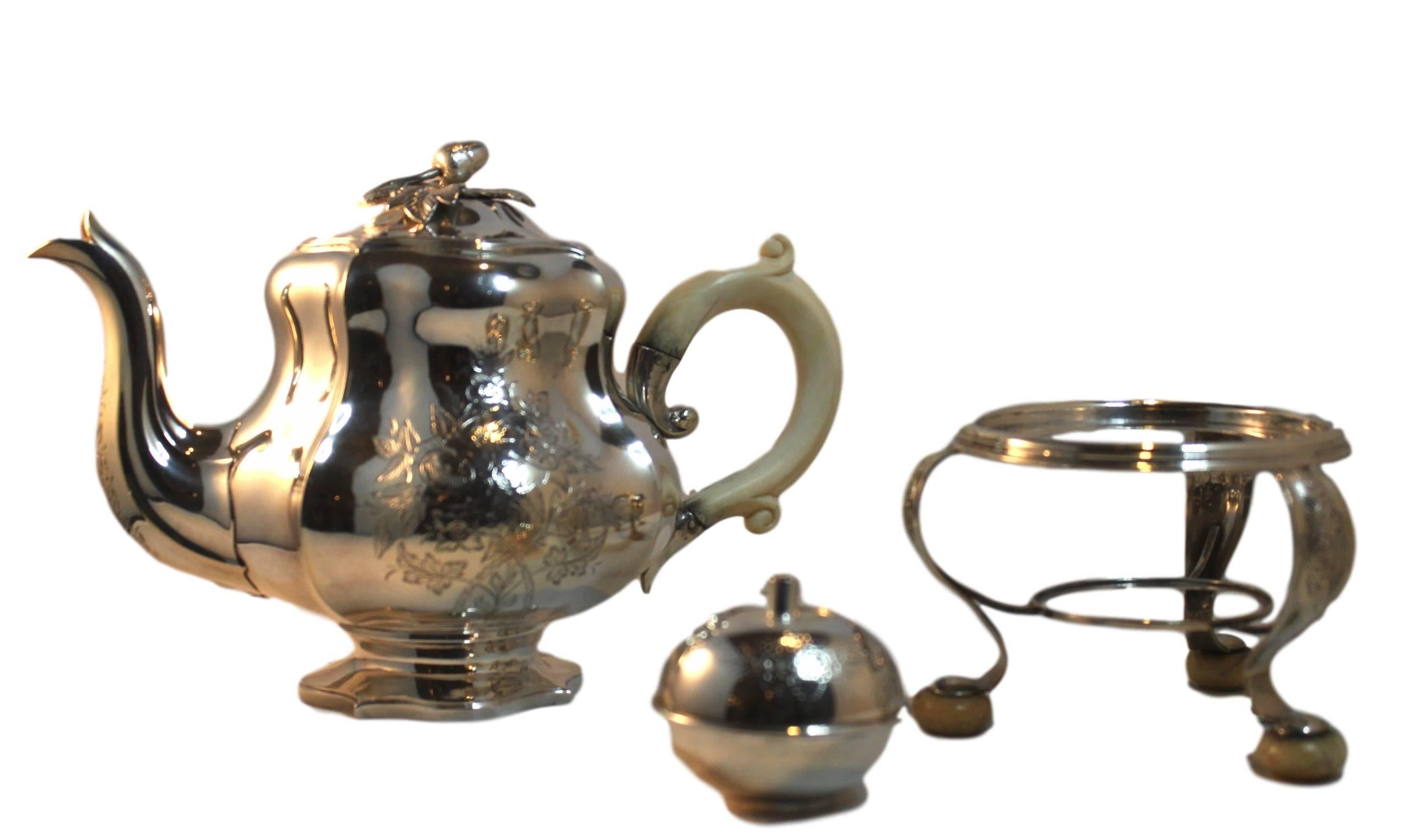 This rare and beautiful decorated Tea set is from the famous jewelry Bonebakker en Zoon in Amsterdam. The set consists of, The tea kettle, sugar bowl and milk can. The tea kettle rests on a standard and beneath that is the burner to keep the tea