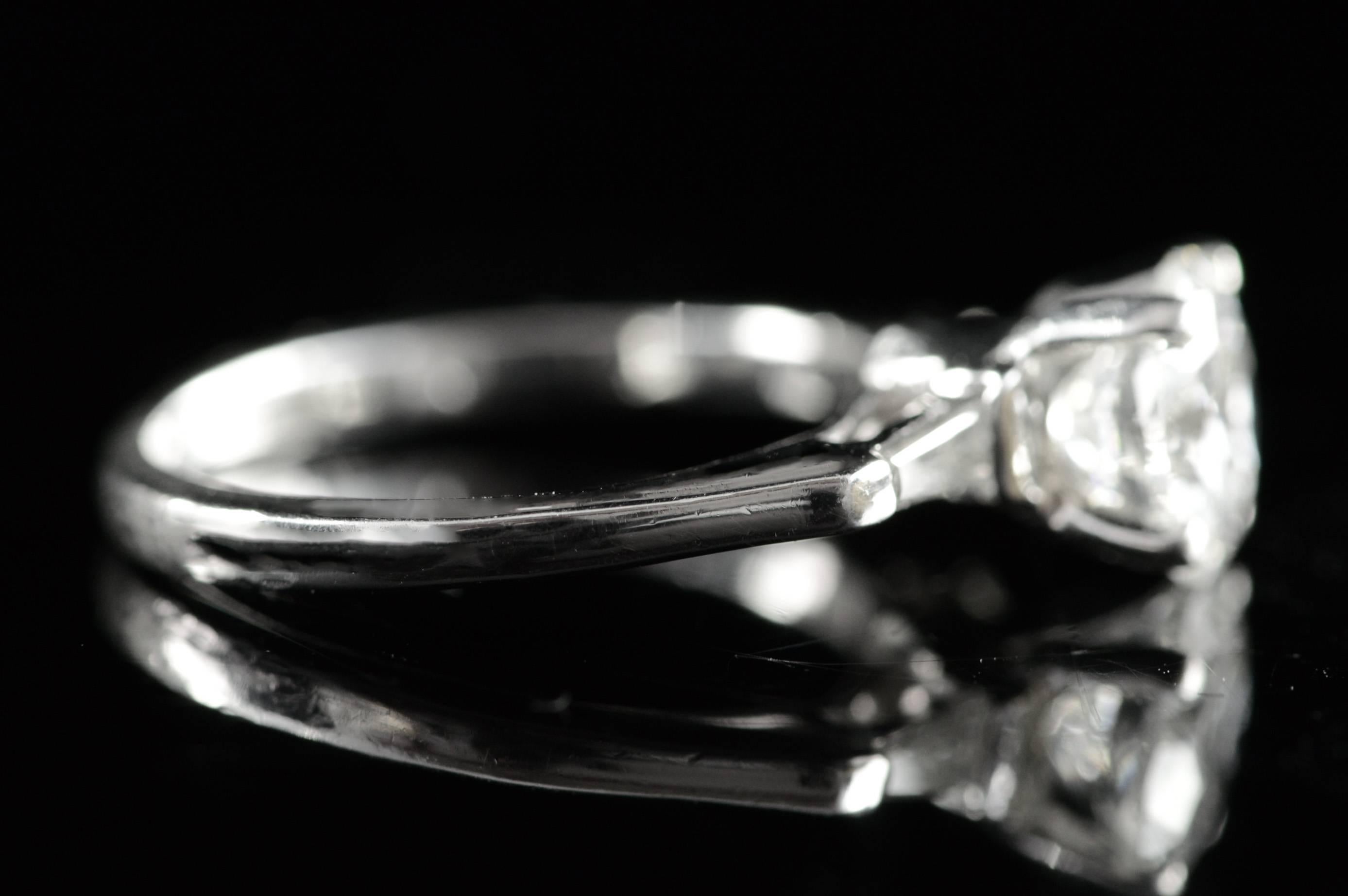 Baguette Cut 1930s 1.34 Carat Round Diamond Platinum Engagement Ring For Sale