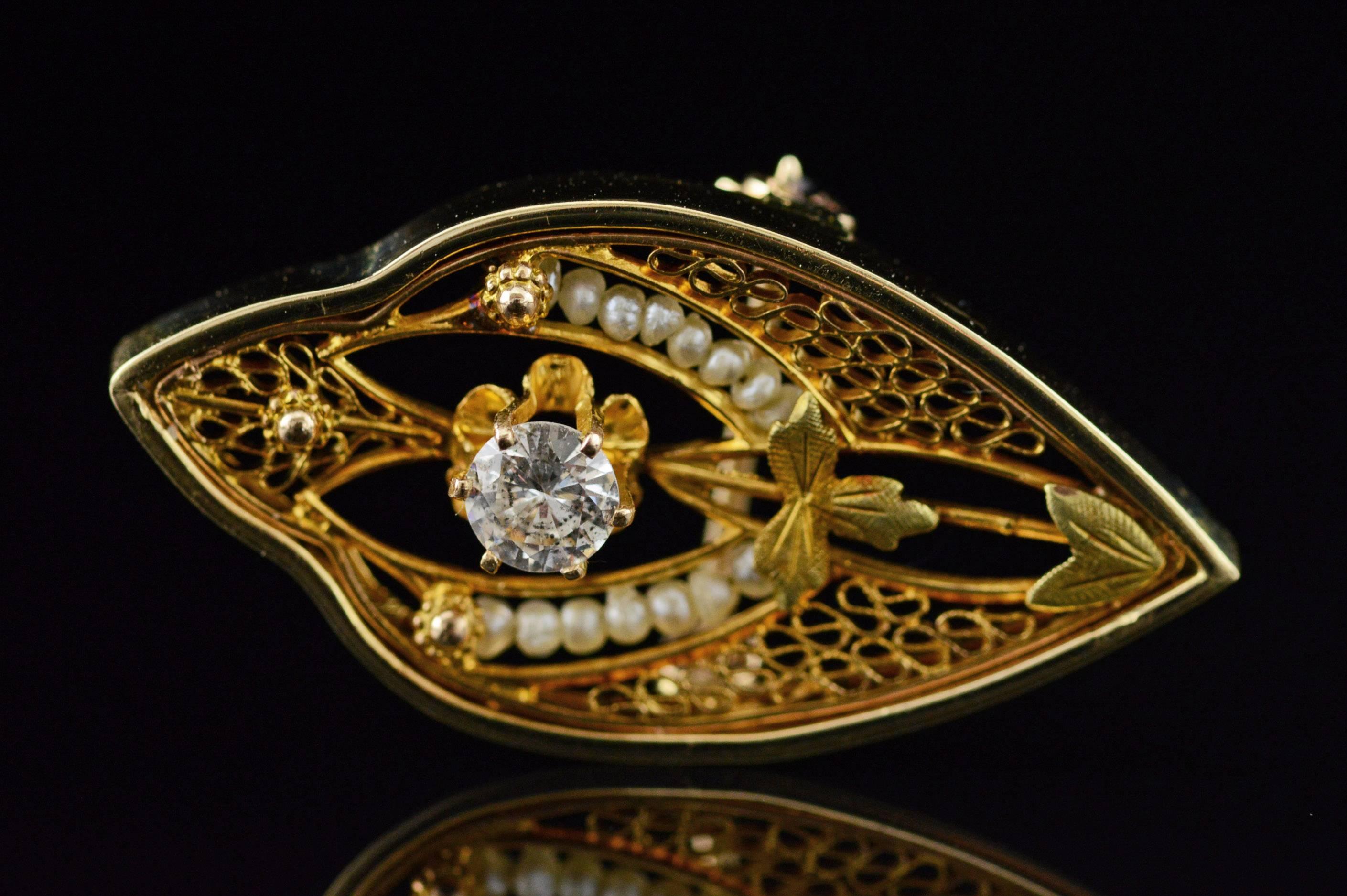 All diamonds are graded according to GIA grading standards. (When applicable)

·Item: 14K Victorian 0.23 CT Diamond Seed Pearl Filigree Pin/Brooch Yellow Gold

·Era: Victorian / 1890s

·Composition: 14k Gold Acid Tested

·Weight: 3.6g