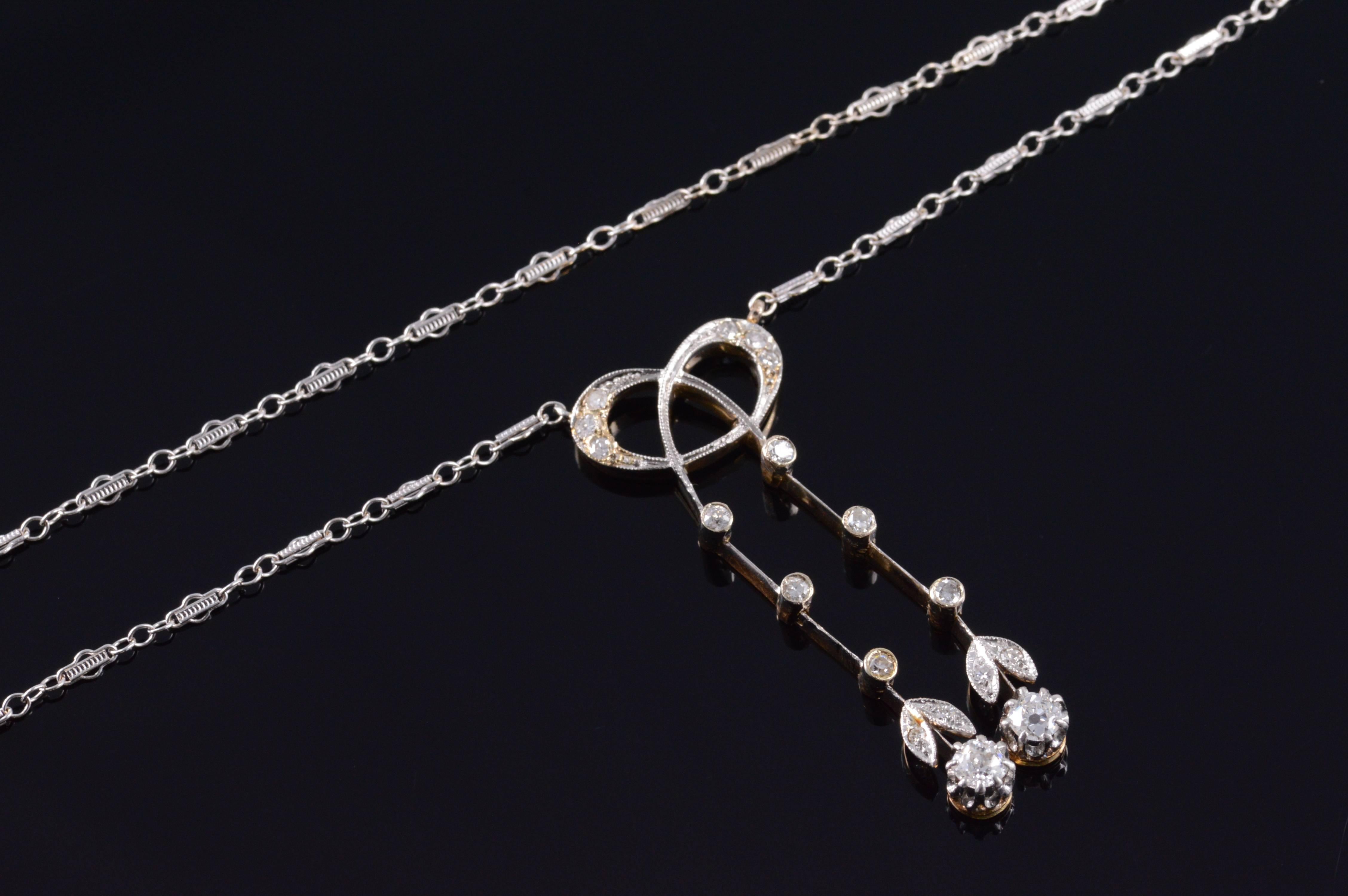Diamond Edwardian Ribbon Necklace. Hand made detailed ribbon necklace 0.65 Ctw old mine cut diamonds. The necklace currently measures 15" and is made out of 14k white gold! 