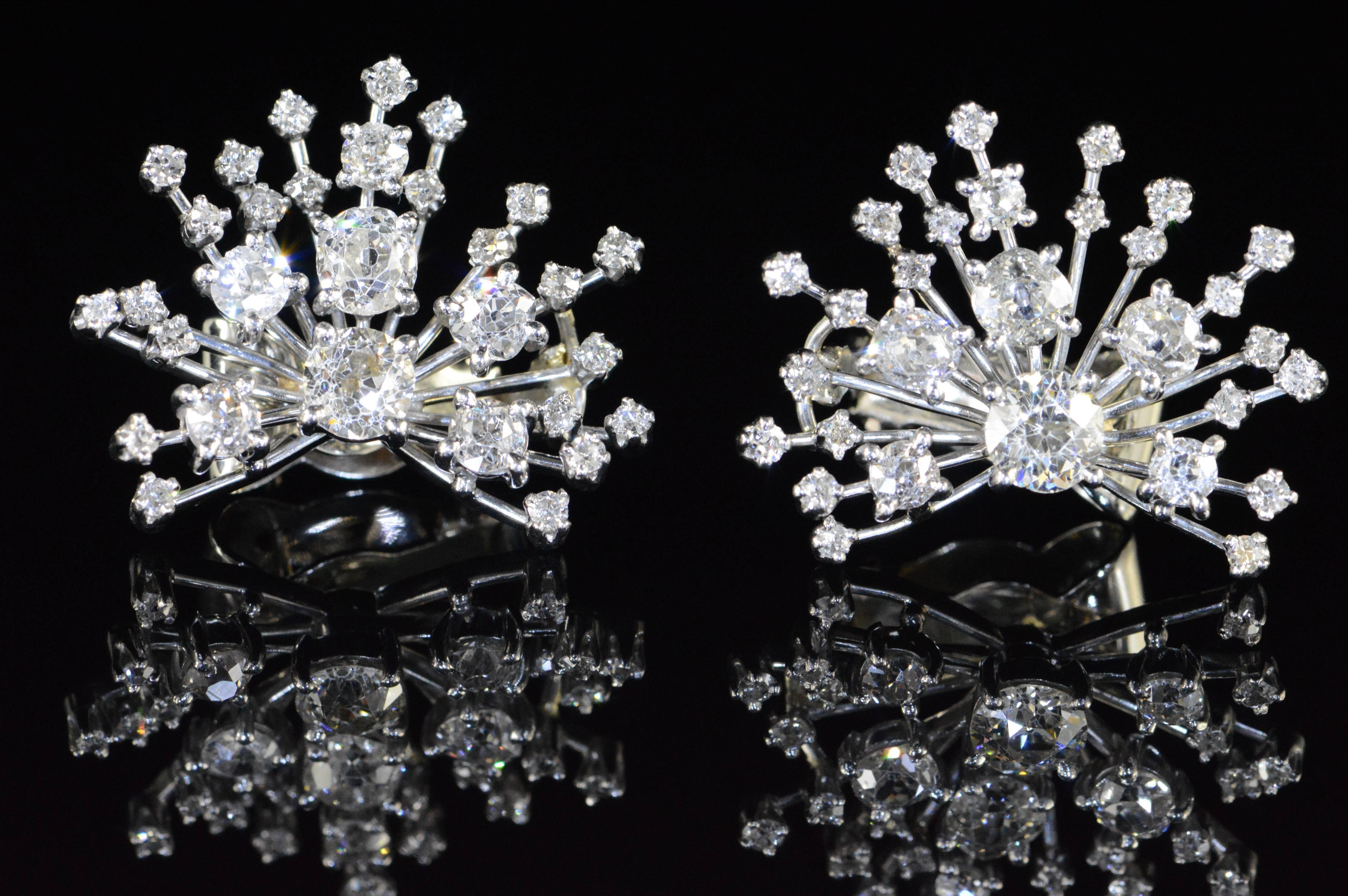 These exquisite star-burst style Art Deco diamond earrings were styled and crafted by Seaman Schepps of New York. The ultra-modern design is offset by old mine cut diamonds to create a beautifully balanced piece.

·Item: 14K 6.70 CTW Mine Cut