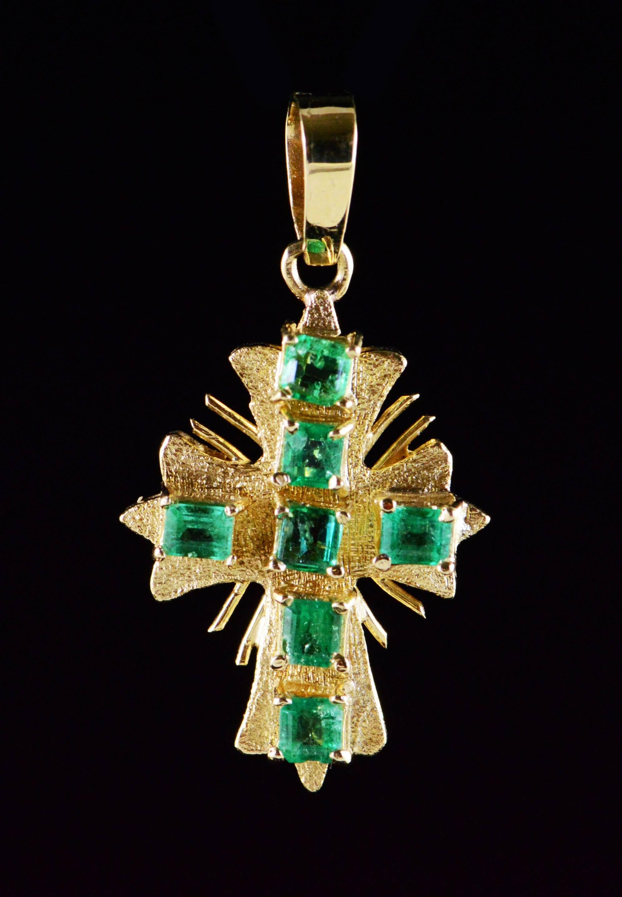 This vintage cross with rays features beautiful emeralds with deep green color saturation.

All diamonds are graded according to GIA grading standards.

·Item: 18K 1.00 Ctw Emerald Vintage Cross Pendant Yellow Gold

·Era/Date: Vintage /