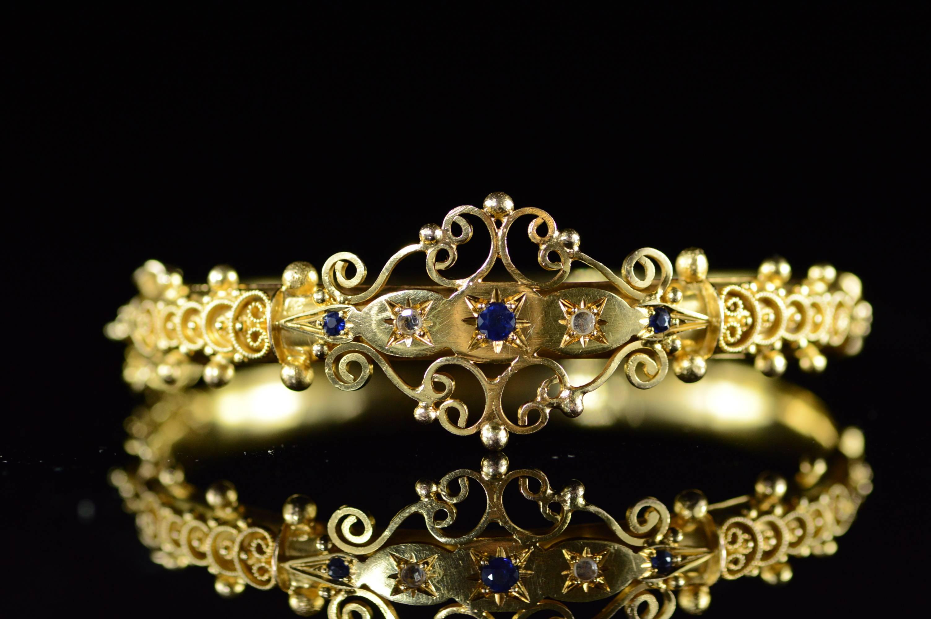 This beautiful bangle is hand constructed with beautiful filigree accents and is set with 0.35ct tw of Sapphires & Rose Cut Diamonds.

All diamonds are graded according to GIA grading standards.

·Item: 14K Victorian 0.35 CTW Sapphire & Rose Cut
