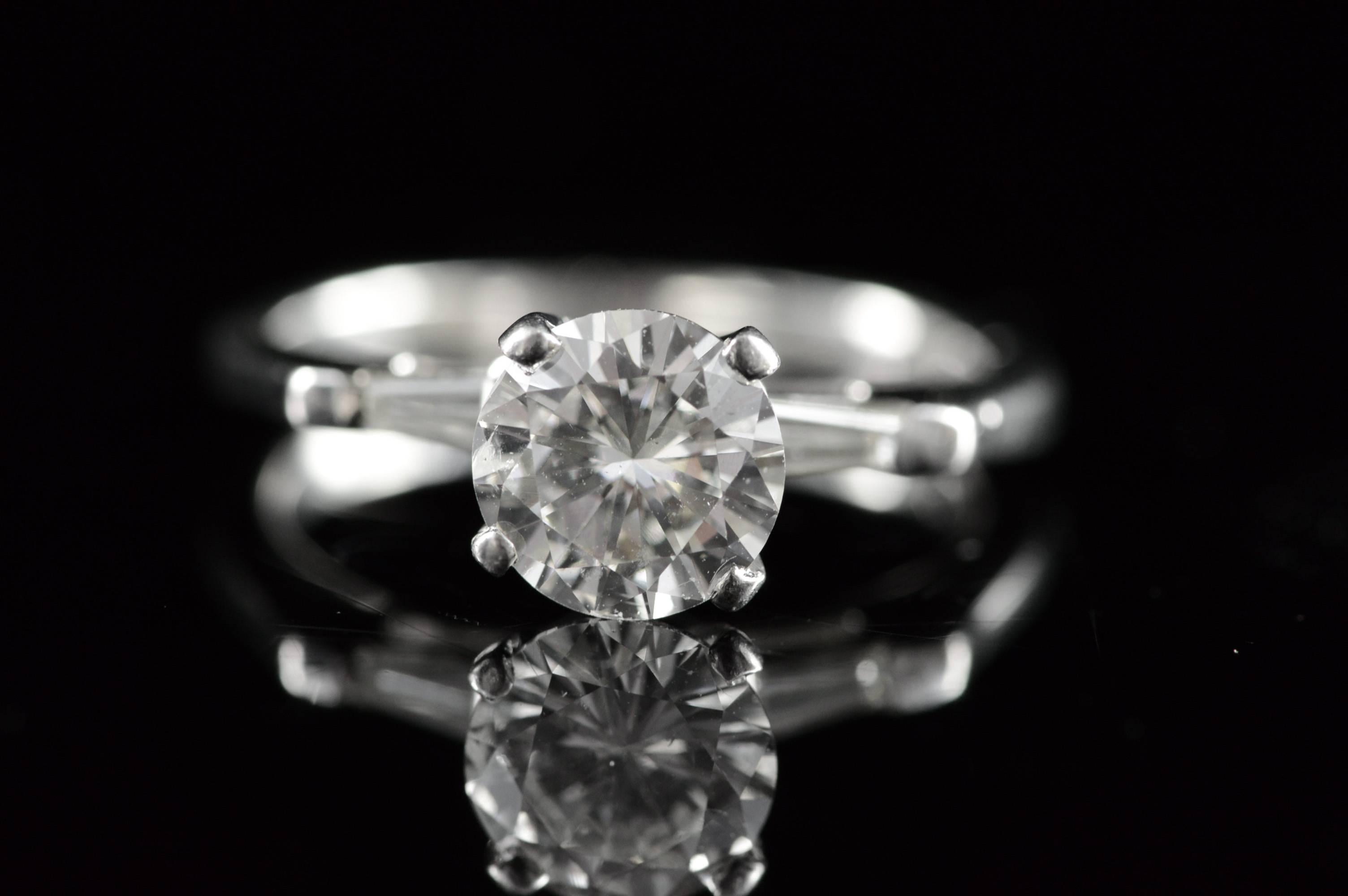 ·Item: Platinum IGI 1.34 Round I SI2 1.59 CTW Baguette Accent Antique Diamond Engagement Ring - Size 5 /

·Era: 1930s

·Composition: Platinum Marked

·Gem Stone: IGI 1.34 Round I SI2, 2x Diamonds, 2x Diamonds=0.25ctw H/SI

·Condition: Estate