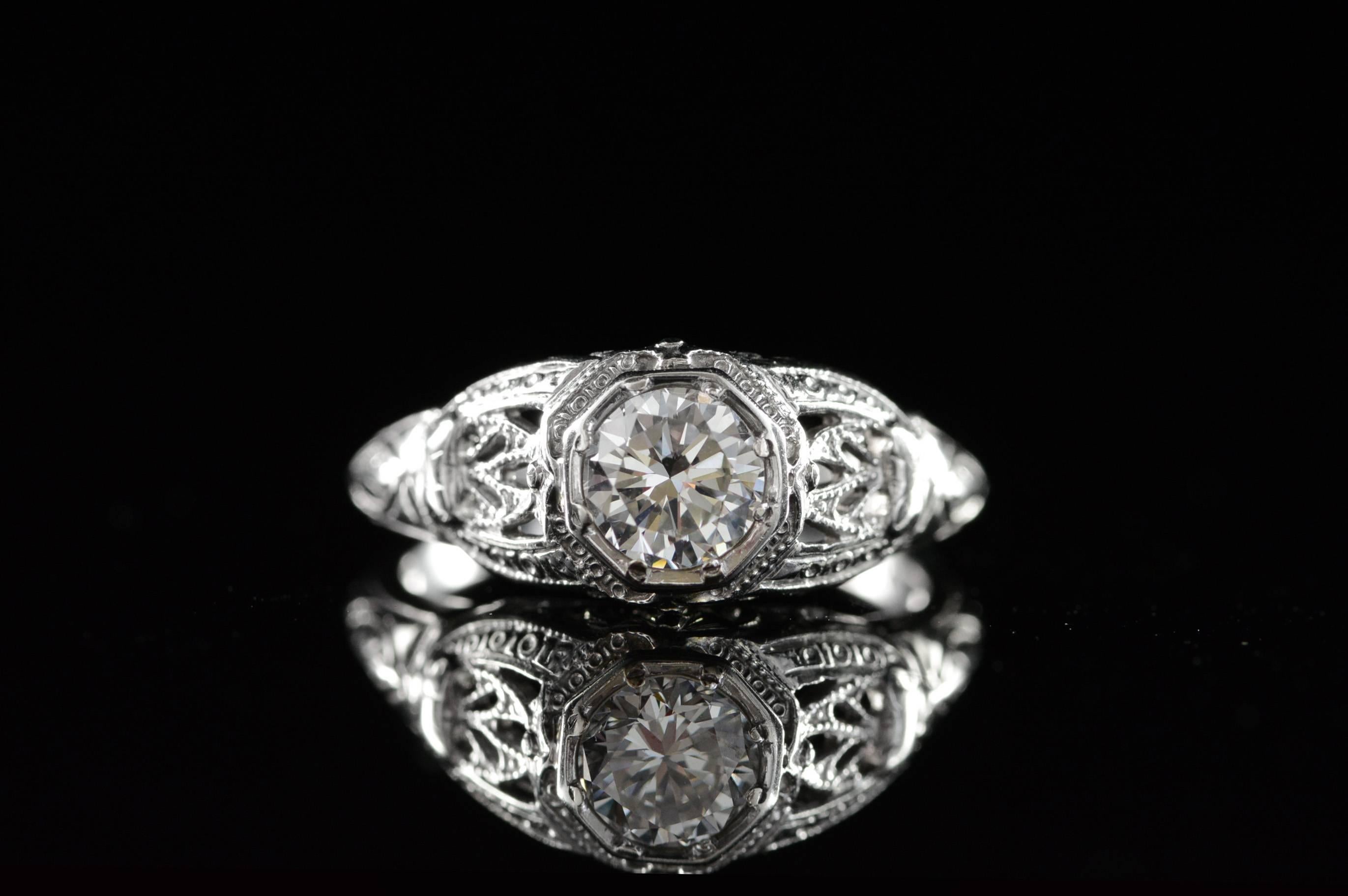 All diamonds are graded according to GIA grading standards.

·Item: 18K 0.54 CT F/VS2 Round Diamond Vintage Filigree Engagement Ring Size 4 White Gold

·Era: 1920s

·Composition: 18k Gold Marked / Tested

·Gem Stone: 0.54ct F/VS2