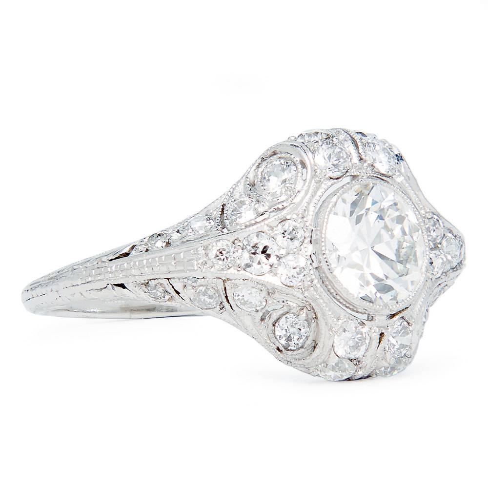 A beautiful and truly one of a kind art deco period diamond engagement ring in luxurious platinum. Centered by a 1.05 carat ultra high quality old European cut diamond, this ring features twenty eight accenting European cut diamonds in one of the