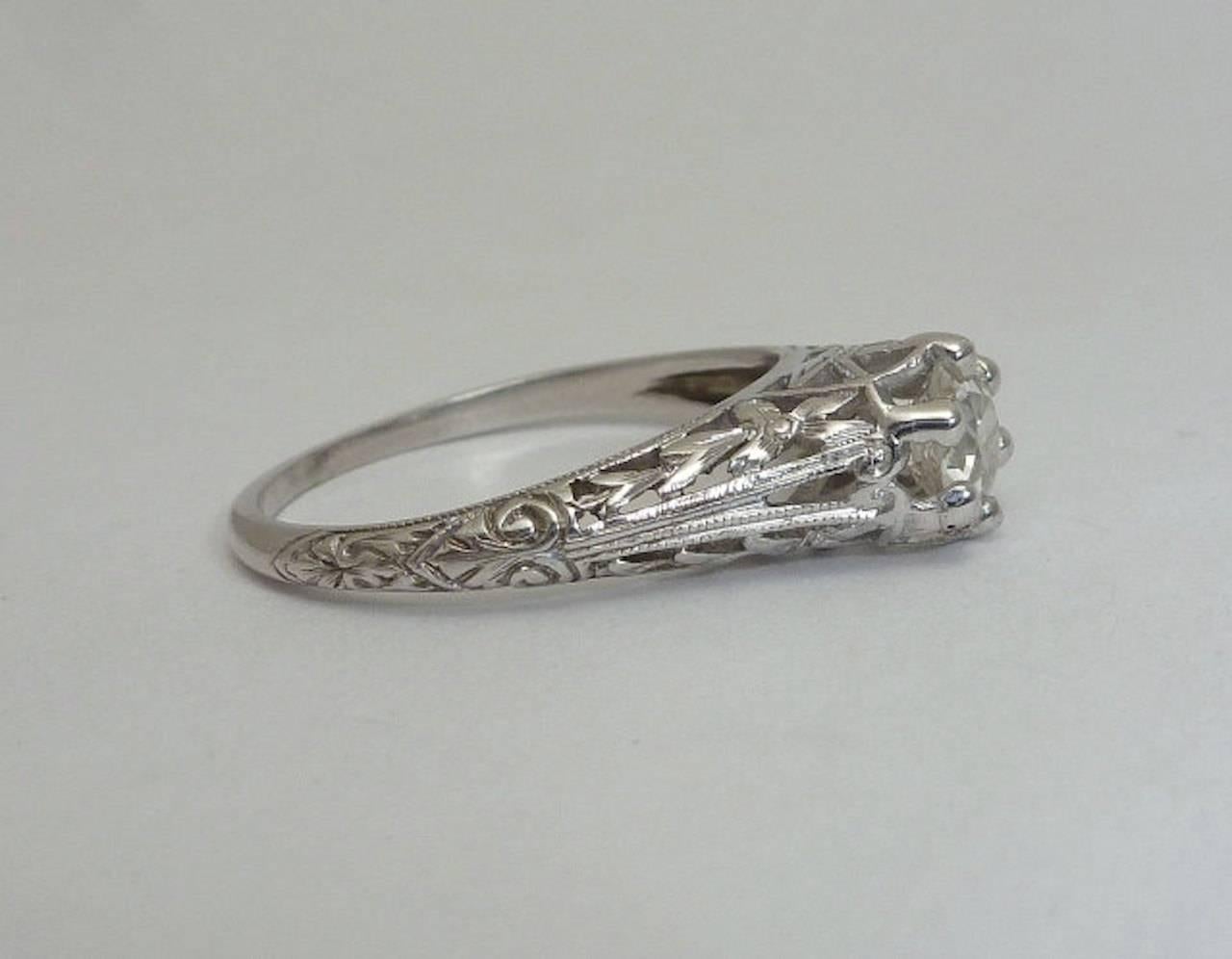 =A rare opportunity to own a wonderful example of an original Orange Blossom pattern diamond ring in luxurious platinum. In beautiful condition, this original hand engraved ring is from the Orange Blossom line by Traub of Michigan.

Once the most