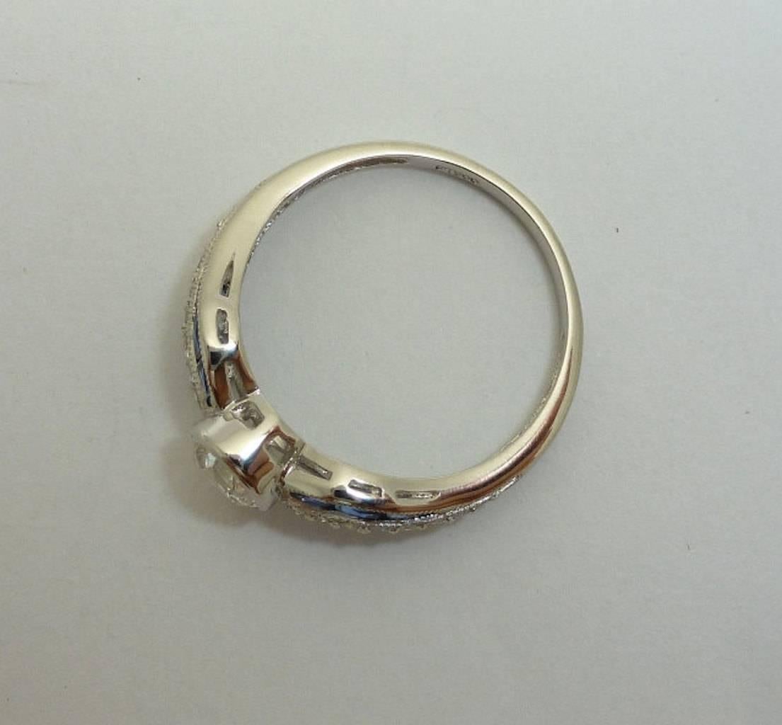 Handmade Sapphire, European Cut Diamond Bow Ring in Platinum For Sale 1