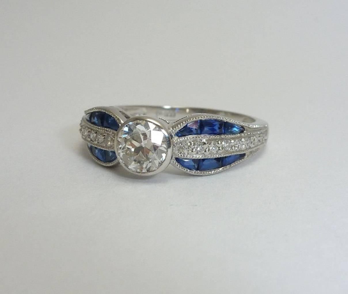 Handmade Sapphire, European Cut Diamond Bow Ring in Platinum In Excellent Condition For Sale In Boston, MA