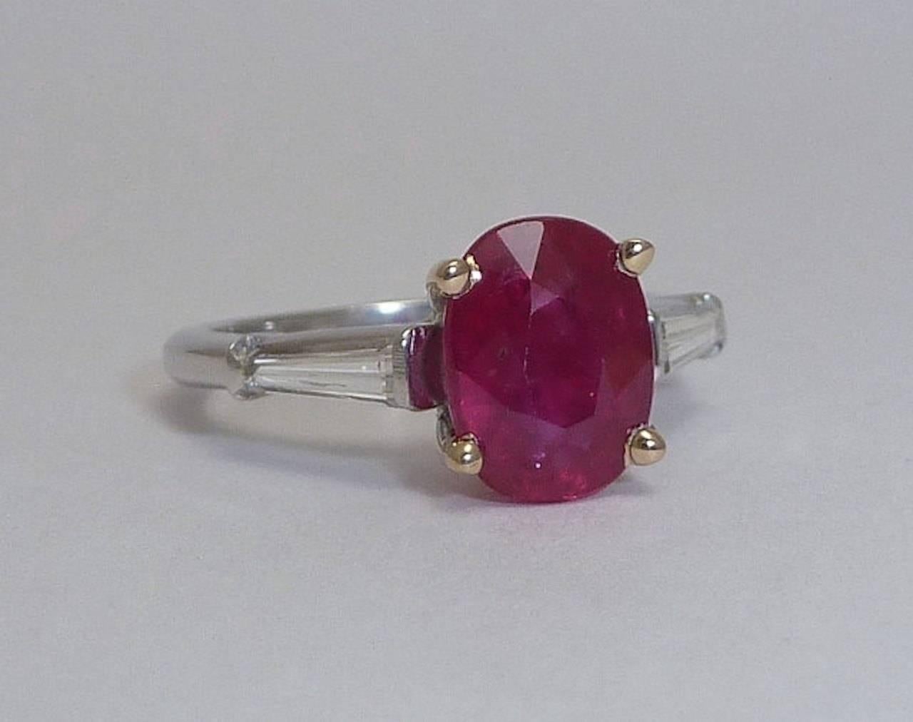 Beacon Hill Jewelers Presents:

An exceptional natural Heat Only 2.46 carat total weight pigeon blood ruby and diamond ring in platinum and 18 karat yellow gold. Centered by a 2.21 carat natural Heat Only ruby set in a yellow gold mount, this ring