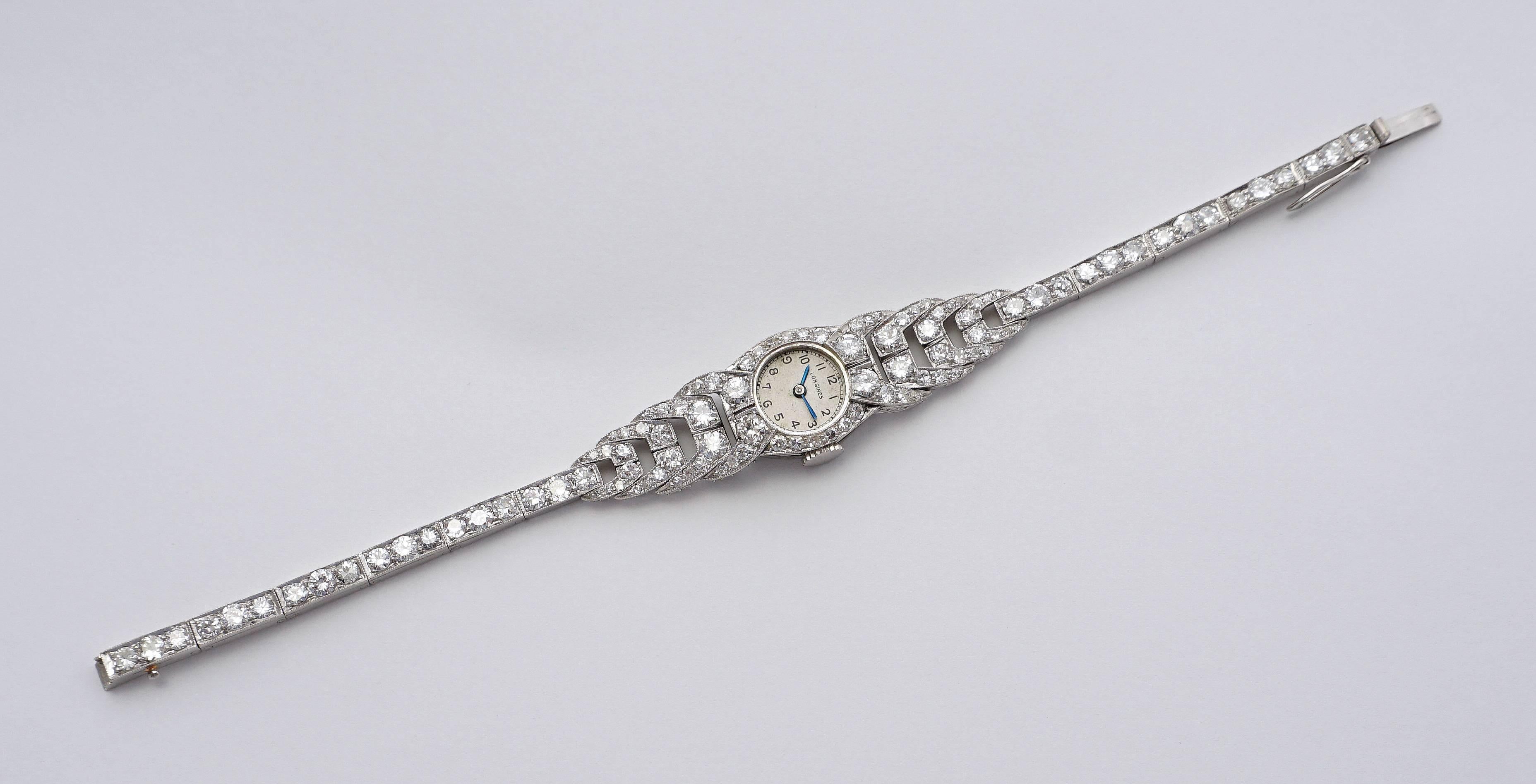 Beacon Hill Jewelers Presents:

A spectacular art deco period ladies diamond set Longines wrist watch in luxurious platinum.  Set with a total of 105 diamonds weighing a combined 7.54 carats, this watch features a truly spectacular art deco design