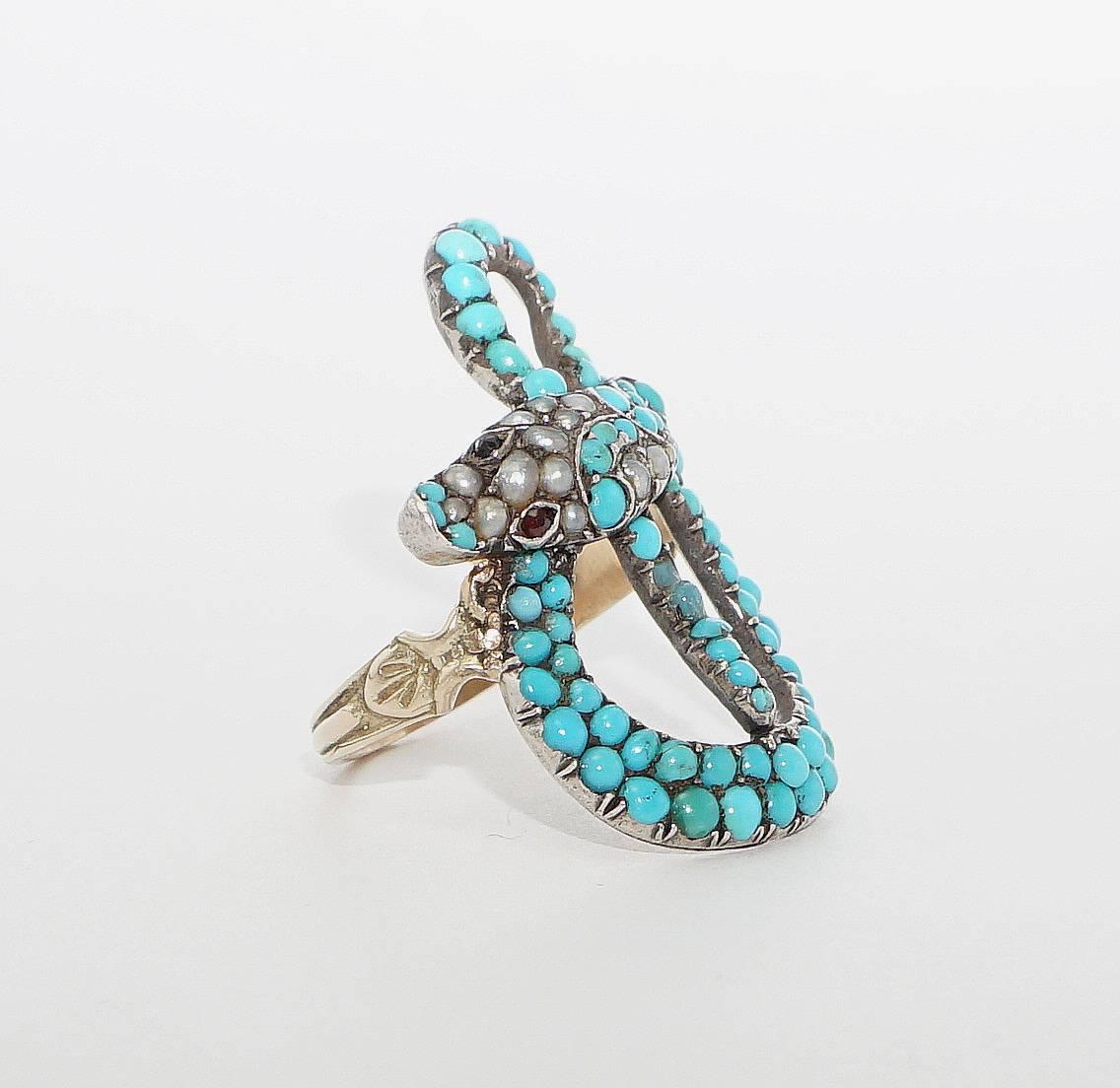 Beacon Hill Jewelers Presents:

A truly exceptional snake form ring in yellow gold. Set throughout with turquoise, pearls, and with rubies for the eyes this fantastic snake ring features the incredibly detailed body of snake affixed to a
