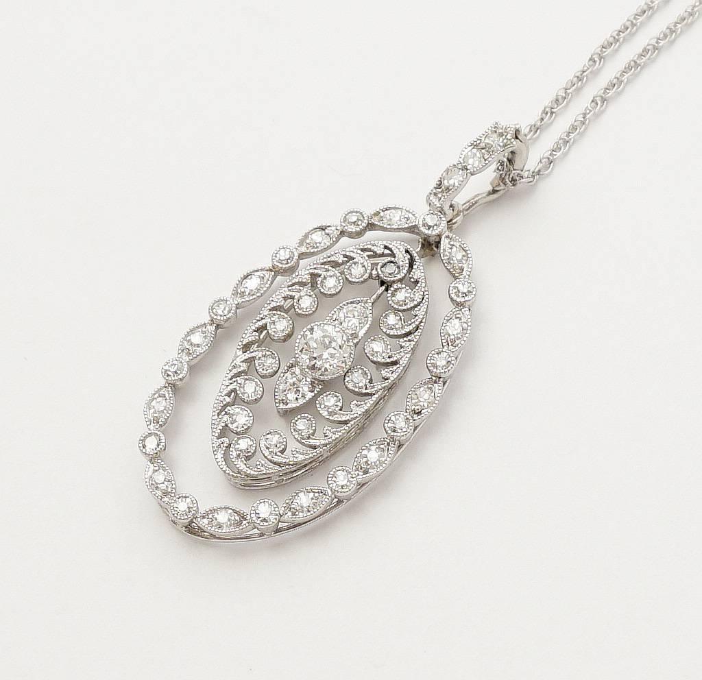 
Beacon Hill Jewelers Presents:

A beautiful edwardian period diamond pendant necklace in platinum by Cartier. Featuring a total of forty six diamonds set throughout a beautifully crafted moving pendant in the classic edwardian