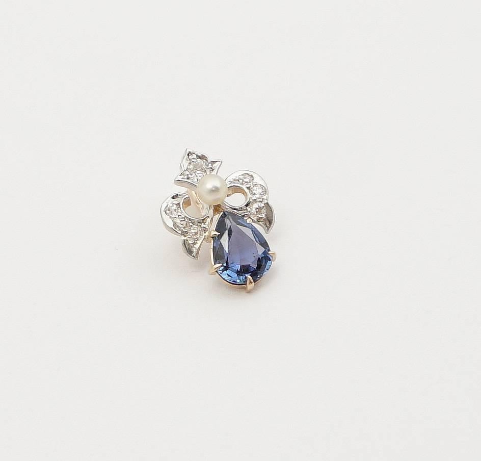 Beacon Hill Jewelers Presents:

A beautiful Edwardian period sapphire and diamond pendant in platinum and 14 karat yellow gold. Featuring diamonds and a sapphire of the finest quality, this pendant also features a single natural