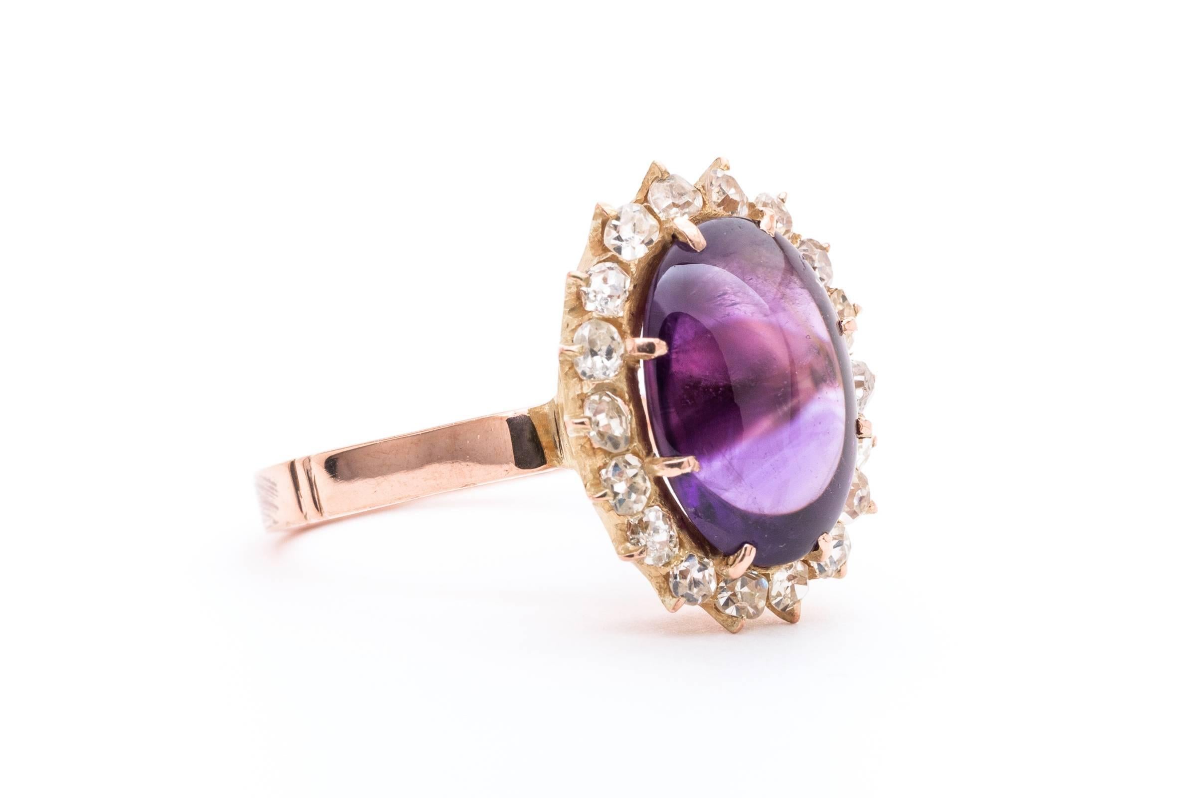 Beacon Hill Jewelers Presents:

An antique Amethyst and Diamond ring in 14 karat rose gold. Centered by a luxurious 5 carat oval cabochon amethyst measuring 12mm by 9mm, this substantial ring is a classic example of late 19th century jewelry.

The