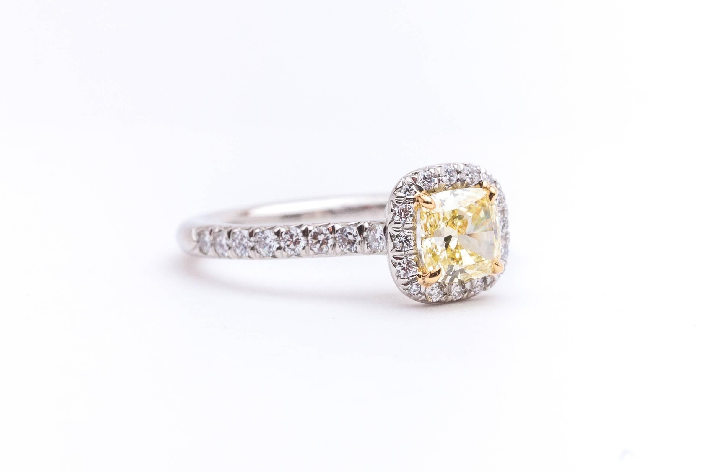 Beacon Hill Jewelers Presents:

A Tiffany & Co. Soleste engagement ring featuring a Fancy Yellow diamond center stone. Crafted in platinum and 18 karat yellow gold this ring features a Fancy Intense Yellow center diamond framed by pave set