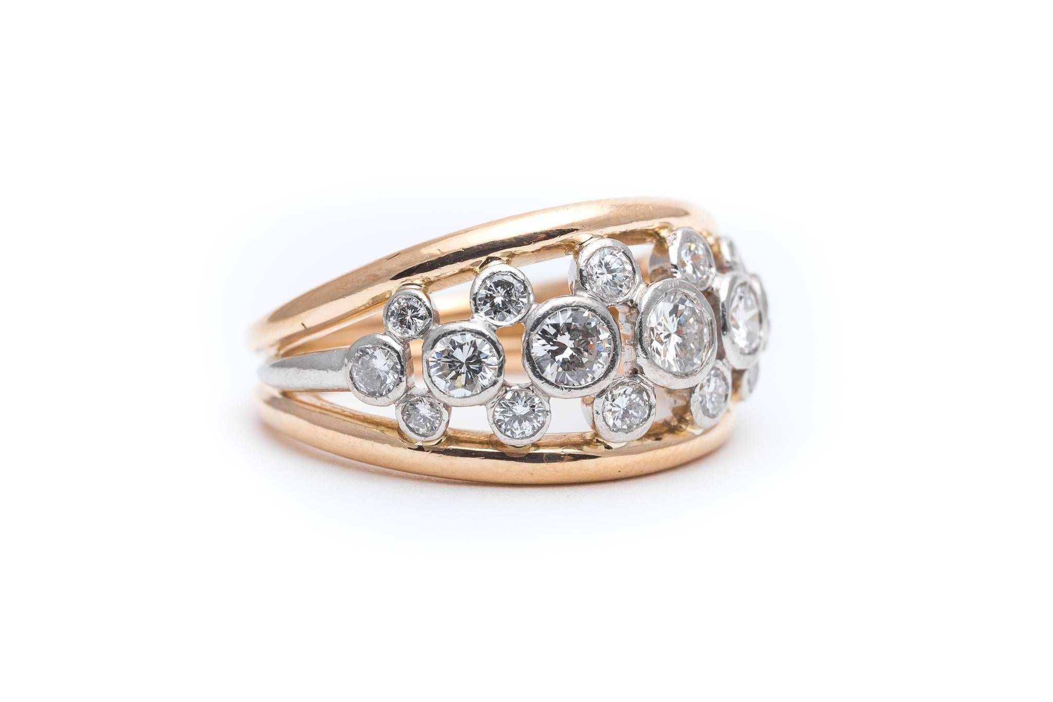 Beacon Hill Jewelers Presents:

A Tiffany & Co. Bubbles diamond platinum and 18 karat yellow gold ring Featuring sparkling brilliant cut diamonds set in brightly polished platinum between two bands of 18 karat yellow gold, this is a classic