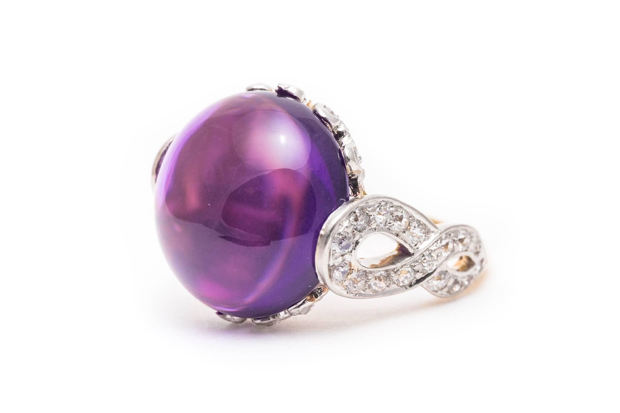 Beacon Hill Jewelers Presents:

A beautiful edwardian period amethyst, and diamond ring in platinum and 18 karat yellow gold. Made by the famous jeweler Black Star and Frost, this ring features a large cabochon cut amethyst set in a crown of