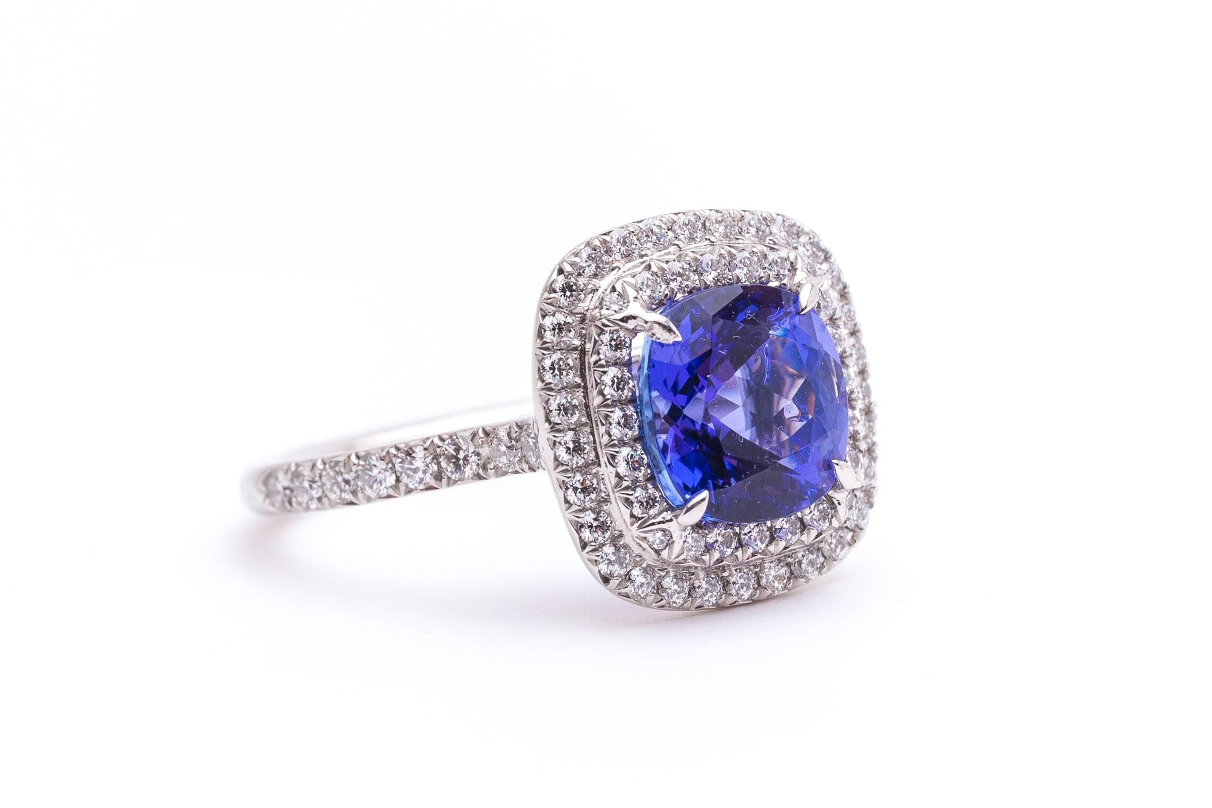 Beacon Hill Jewelers Presents:

A Tiffany & Co. Soleste collection tanzanite and diamond ring in luxurious platinum.  Centered by a beautiful and top quality 2 carat cushion shaped tanzanite this ring features a double halo of sparkling brilliant