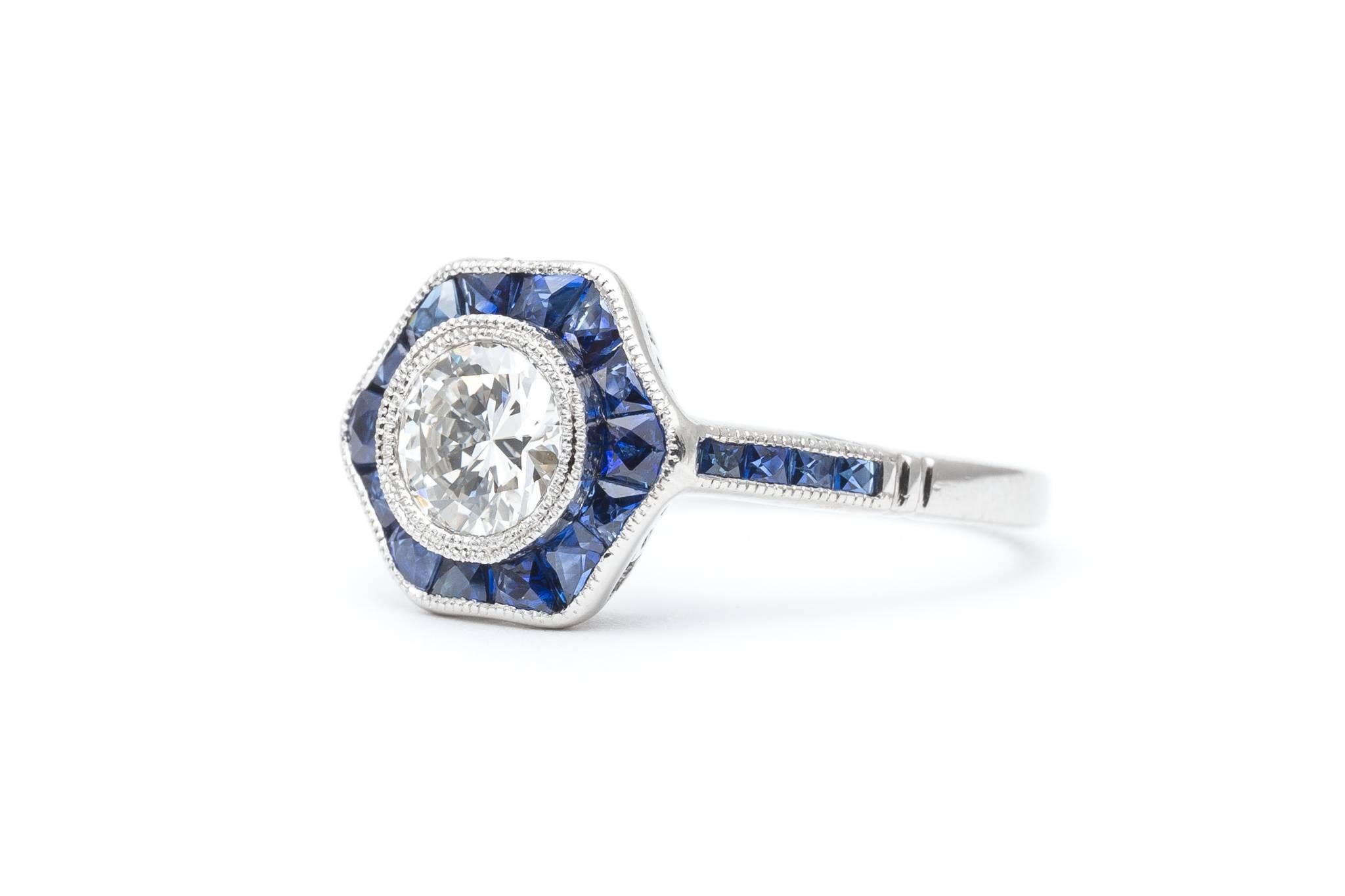 Diamond, Sapphire Flower Engagement Ring in Luxurious Platinum In Excellent Condition For Sale In Boston, MA
