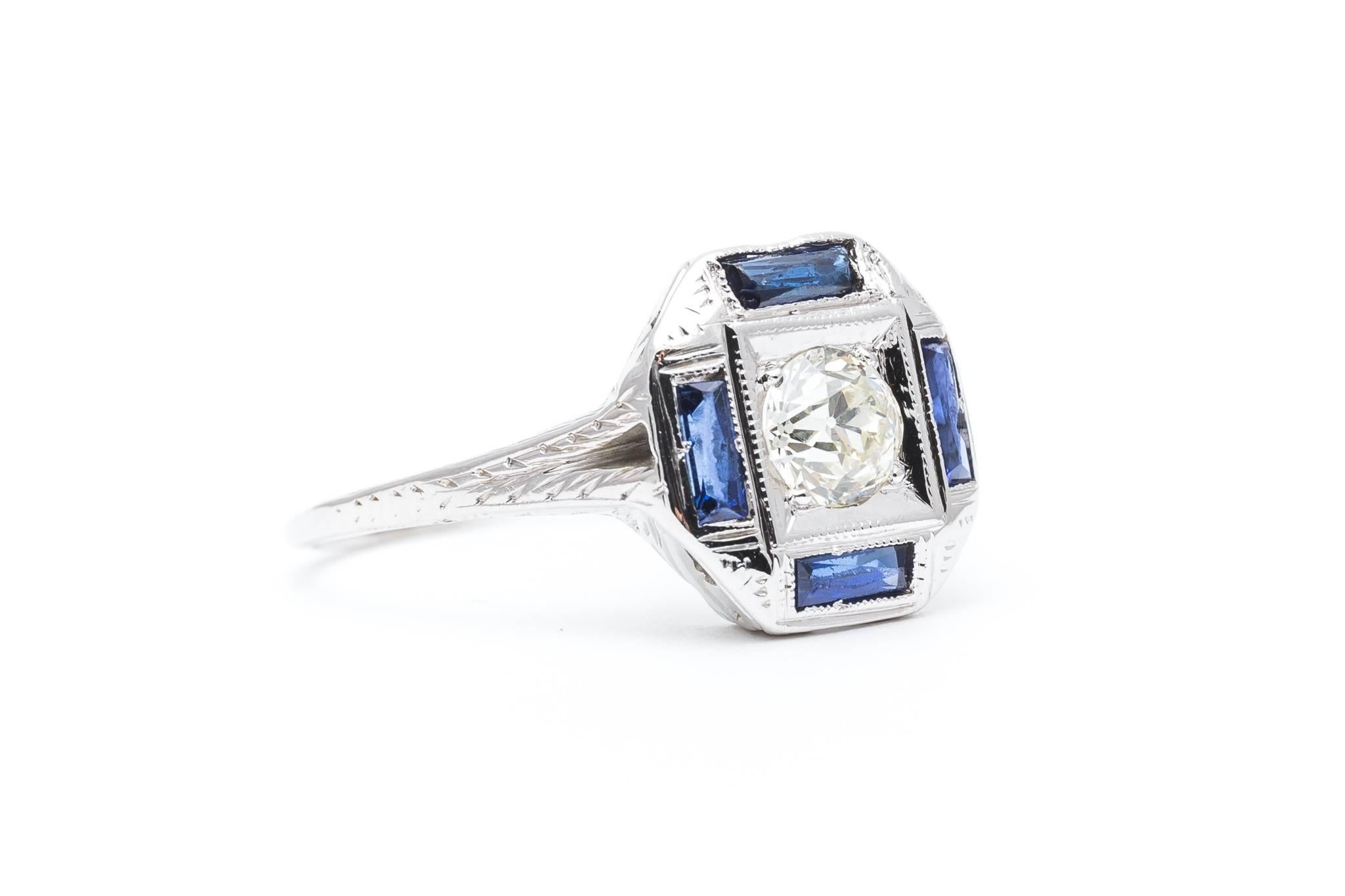 A beautiful original early art deco period diamond and sapphire engagement ring in 18 karat white gold. Made by the original inventors of the white gold alloy, this original Belais signed ring is a scarce example of an original Belais Brothers