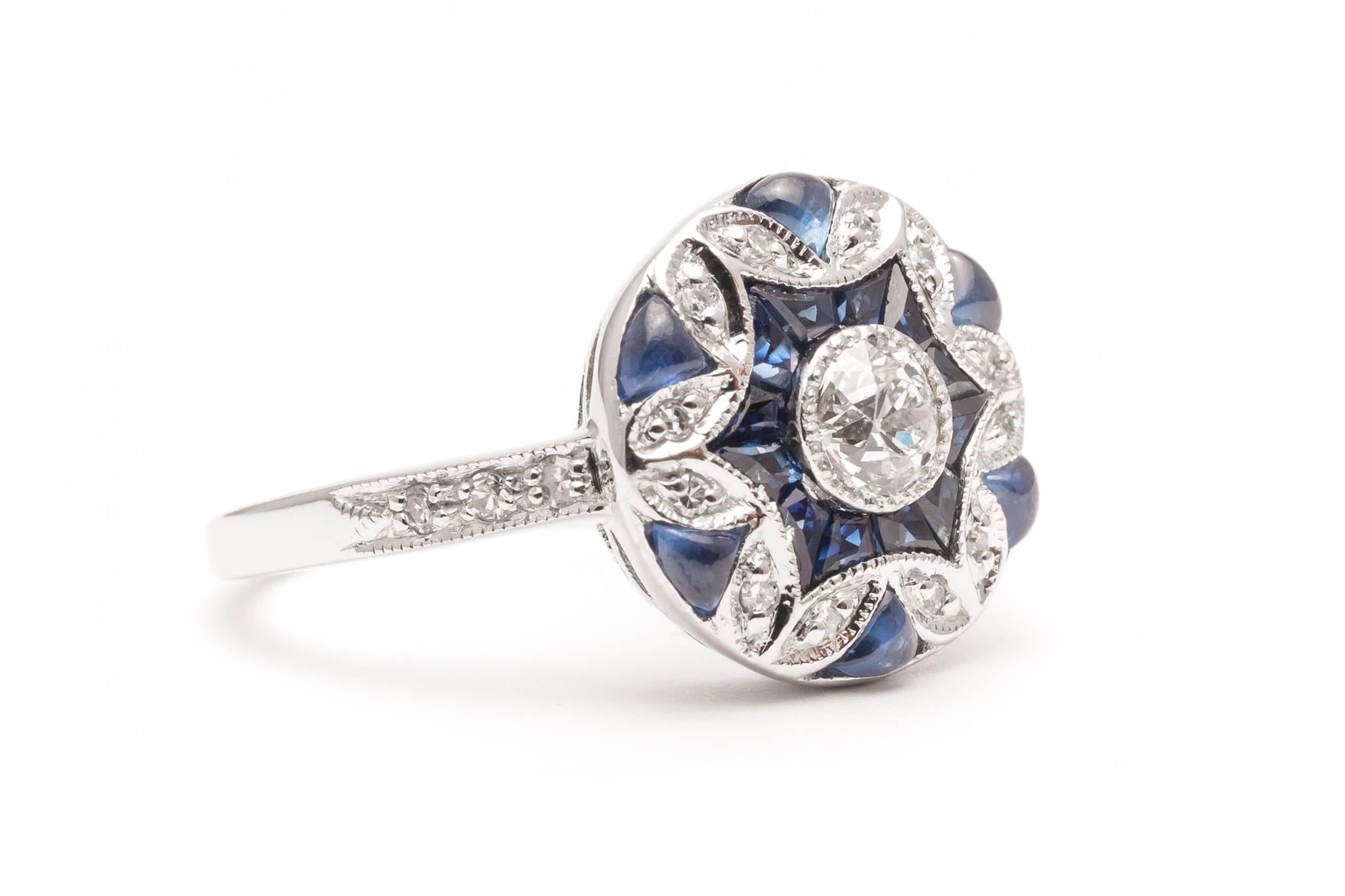 Beacon Hill Jewelers Presents:

A unique and beautiful  diamond ring in 14 karat white gold featuring French and cabochon cut sapphires. Entirely hand crafted, this spectacular ring is one of the most unique pieces we've had the pleasure of offering