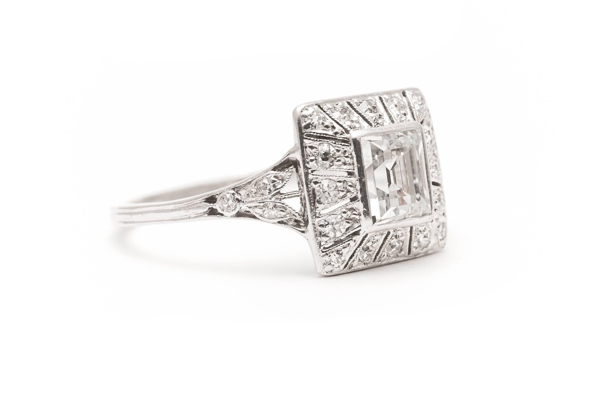 Beacon Hill Jewelers Presents:

A beautiful original art deco period diamond engagement ring set in luxurious platinum.  Centered by a high quality Step cut diamond this ring features fantastic wire and filigree work throughout.

Grading in our